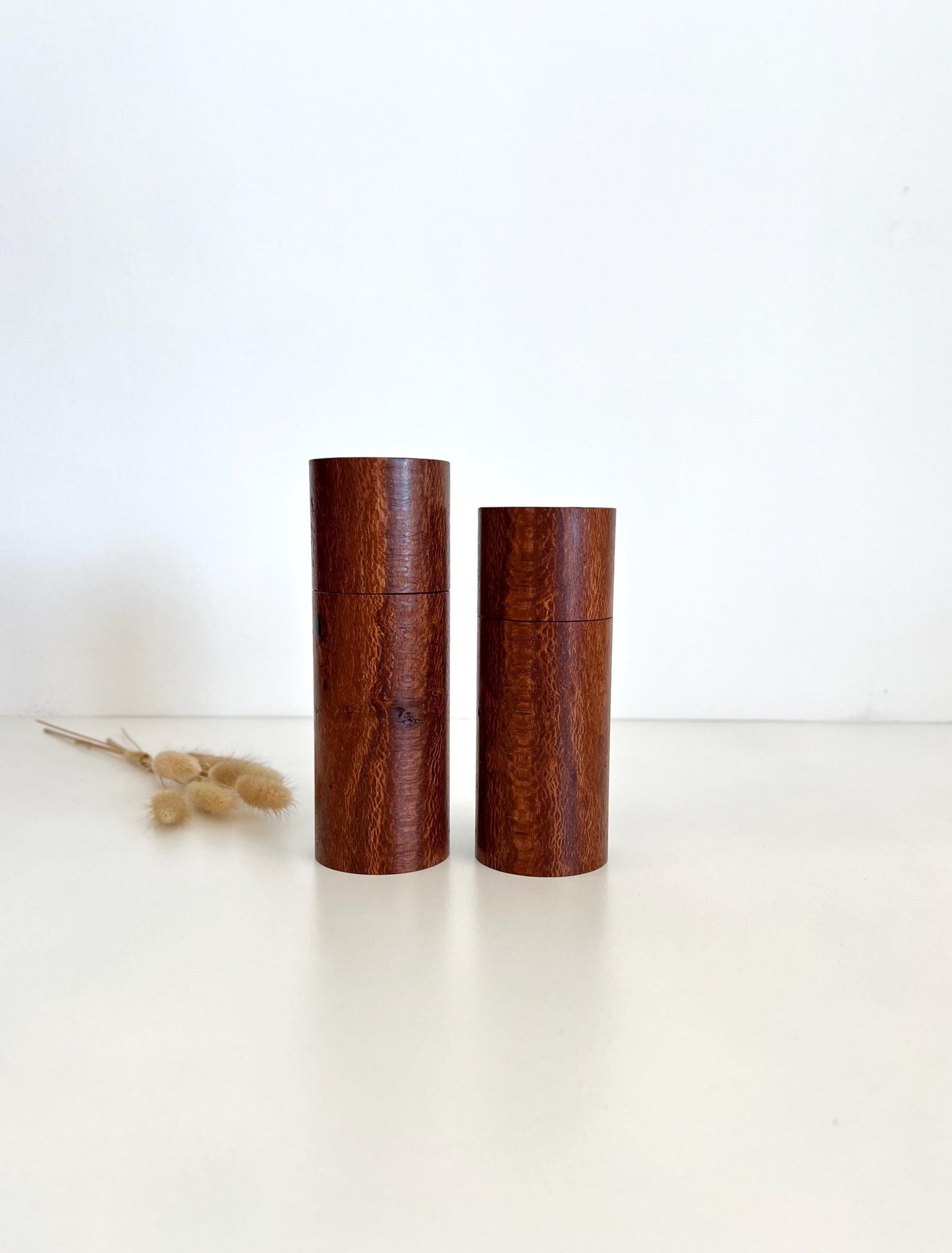 Wooden cylindrical shape salt and pepper grinders made from Banksia timber