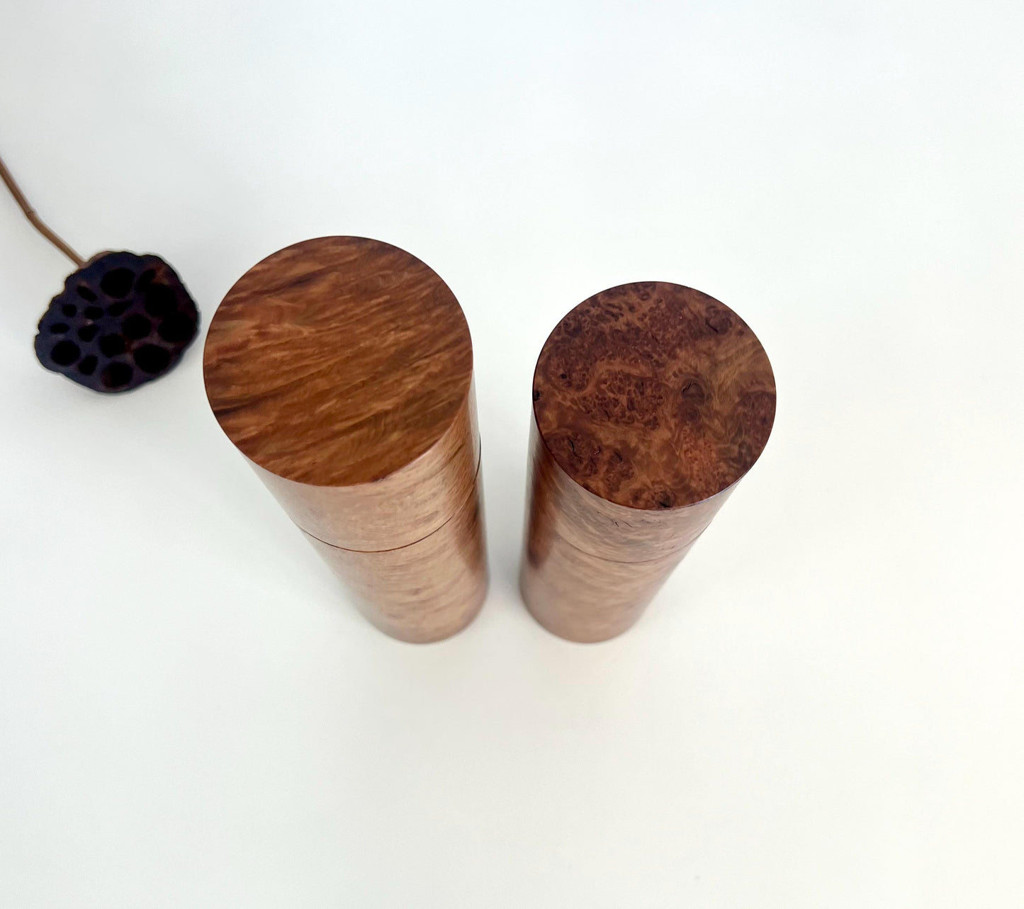 Birdseye view of wooden cylindrical shape salt and pepper grinders made from Australian Blackbutt burl timber