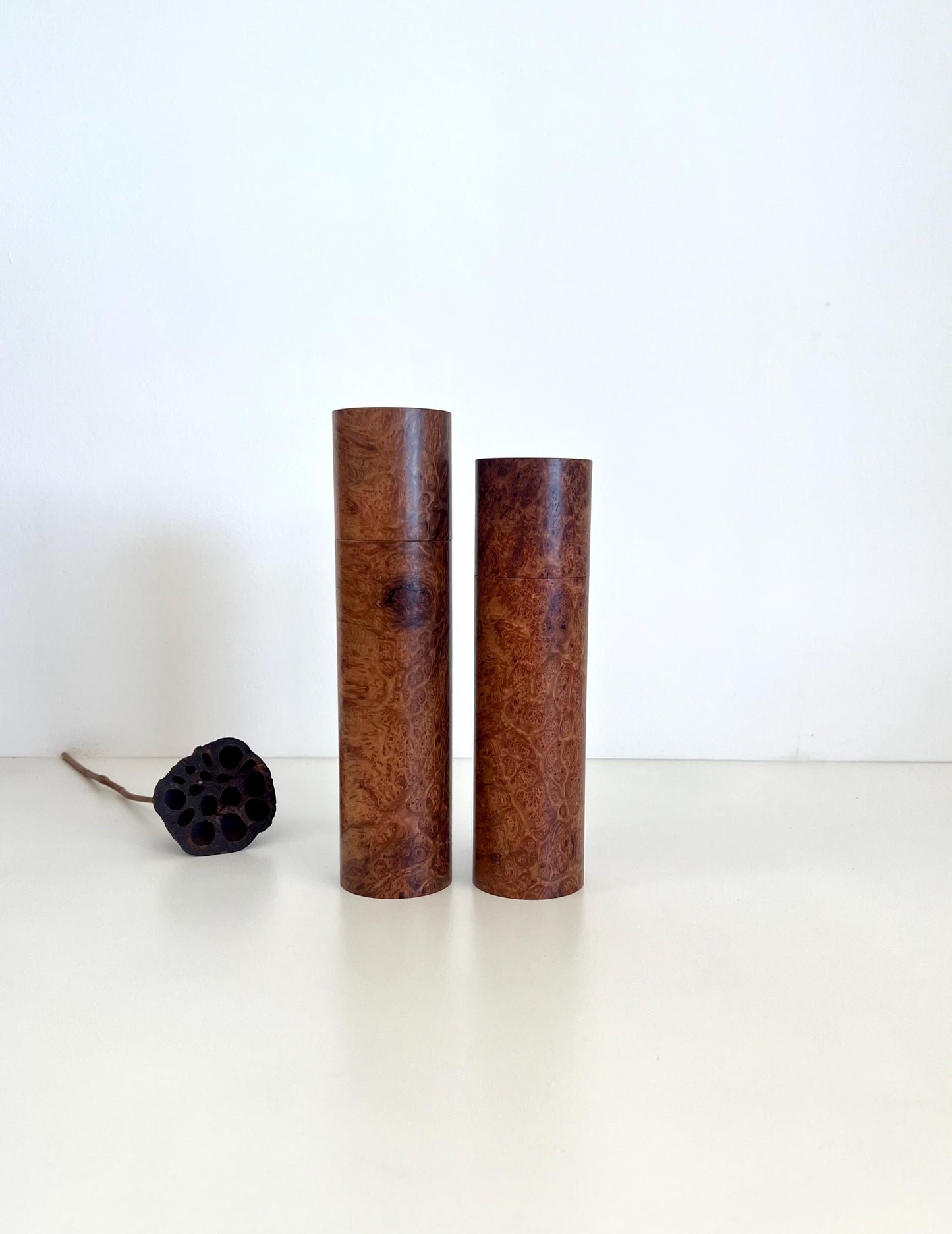 Wooden cylindrical shape salt and pepper grinders made from Blackbutt burl timber