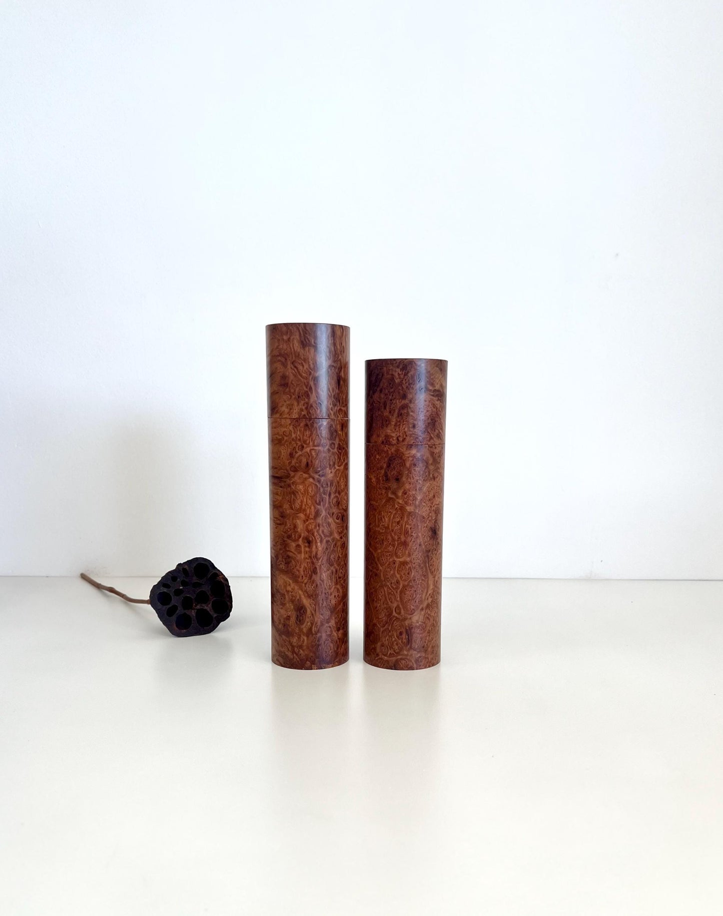Wooden cylindrical shape salt and pepper grinders made from Blackbutt burl timber