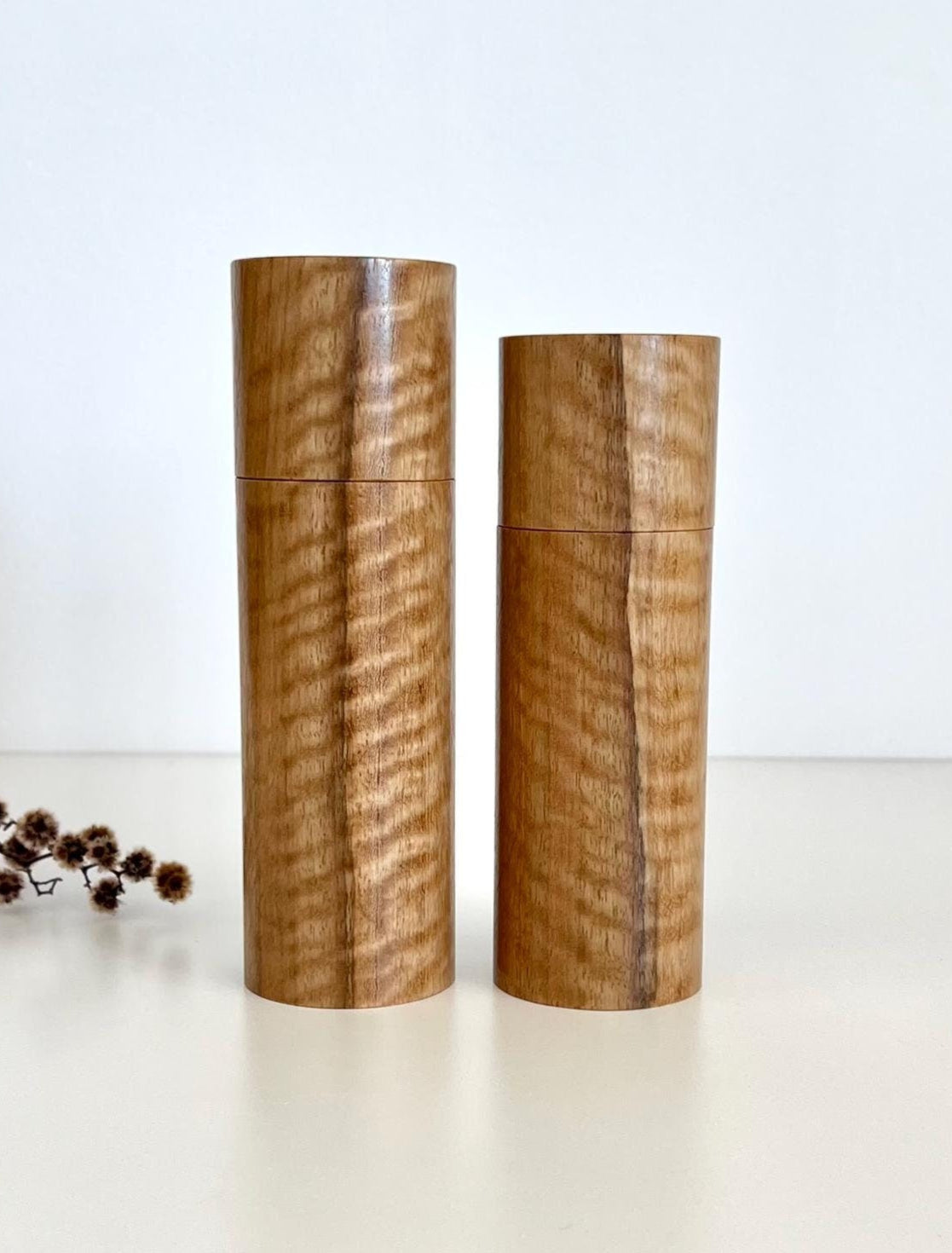 Wooden cylindrical shape salt and pepper grinders made from Marri timber