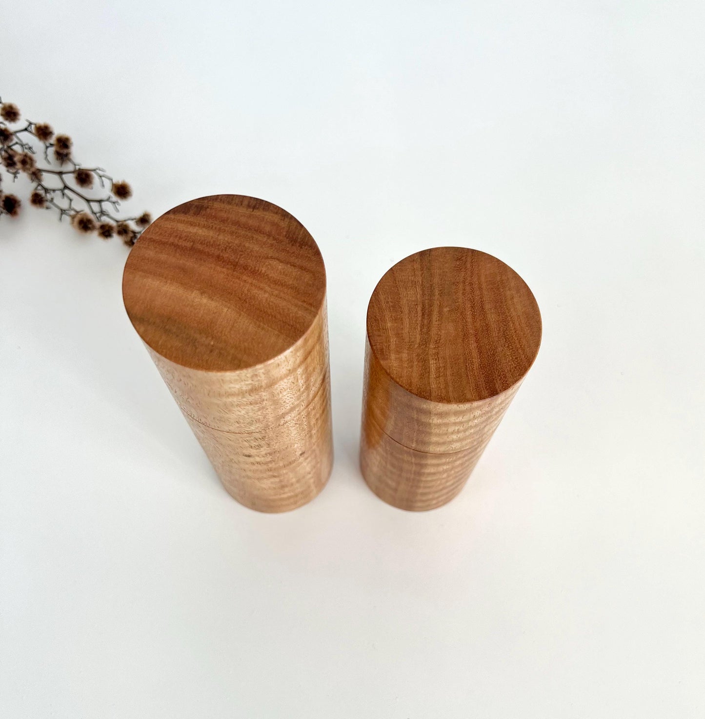 Birdseye view of wooden cylindrical shape salt and pepper grinders made from Australian Marri timber