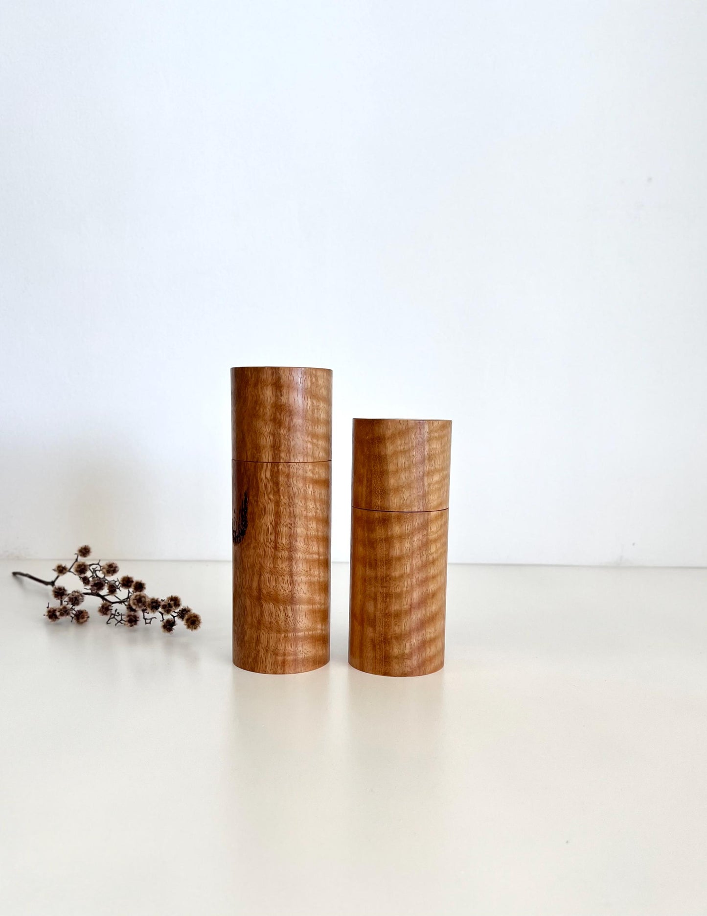 Wooden cylindrical shape salt and pepper grinders made from Marri timber