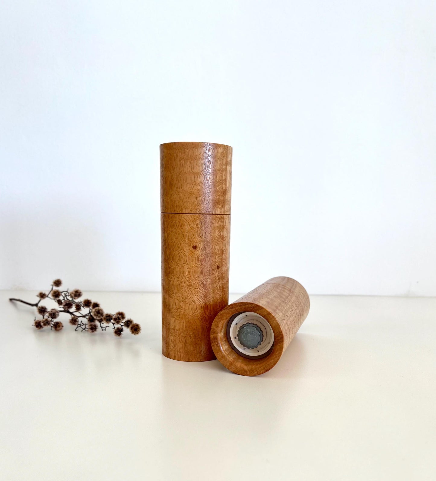 Bottom of salt and pepper grinder showing Crushgrind ceramic grinding mechanism and the adjustment knob