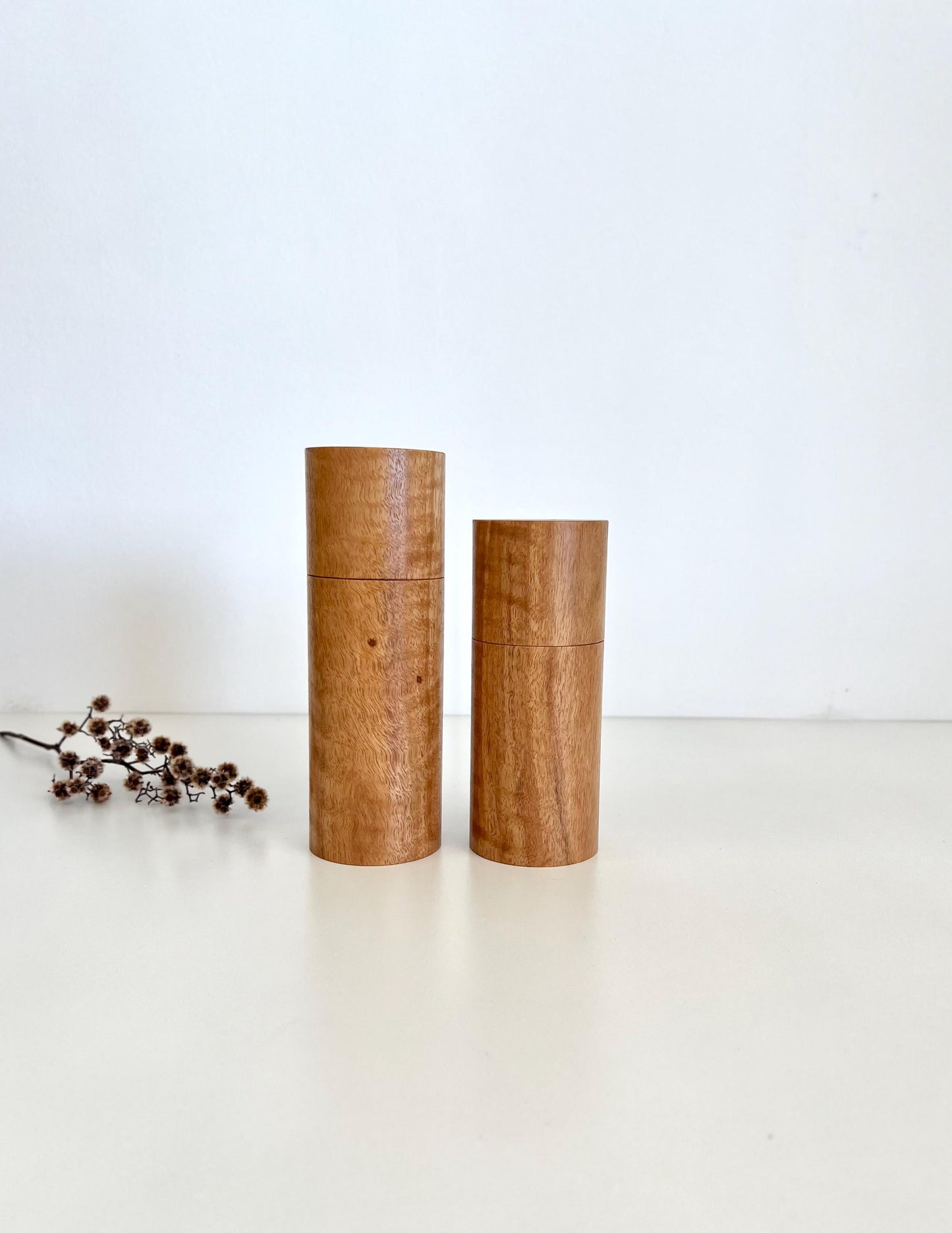 Wooden cylindrical shape salt and pepper grinders made from Marri timber