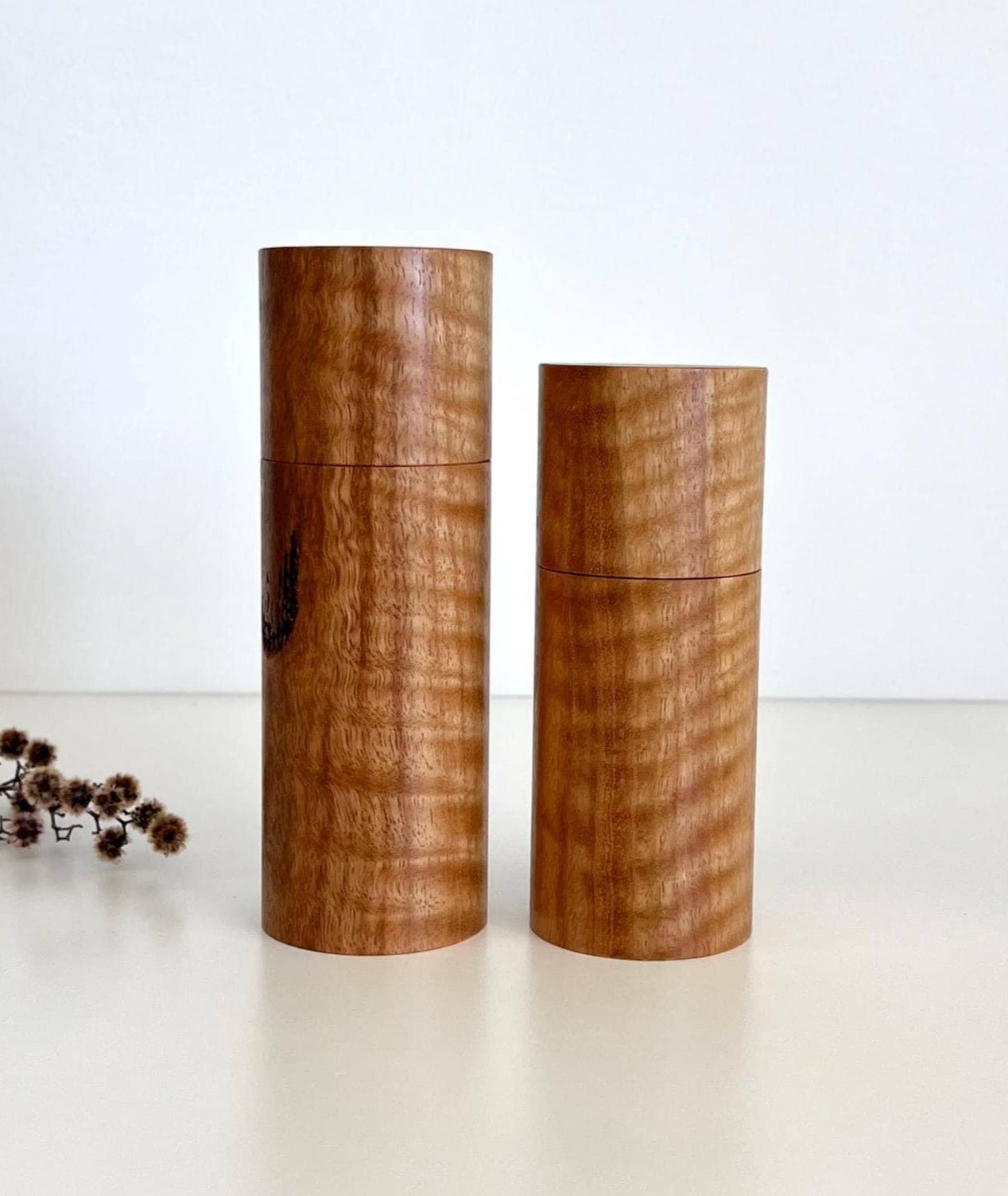 Wooden cylindrical shape salt and pepper grinders made from Marri timber