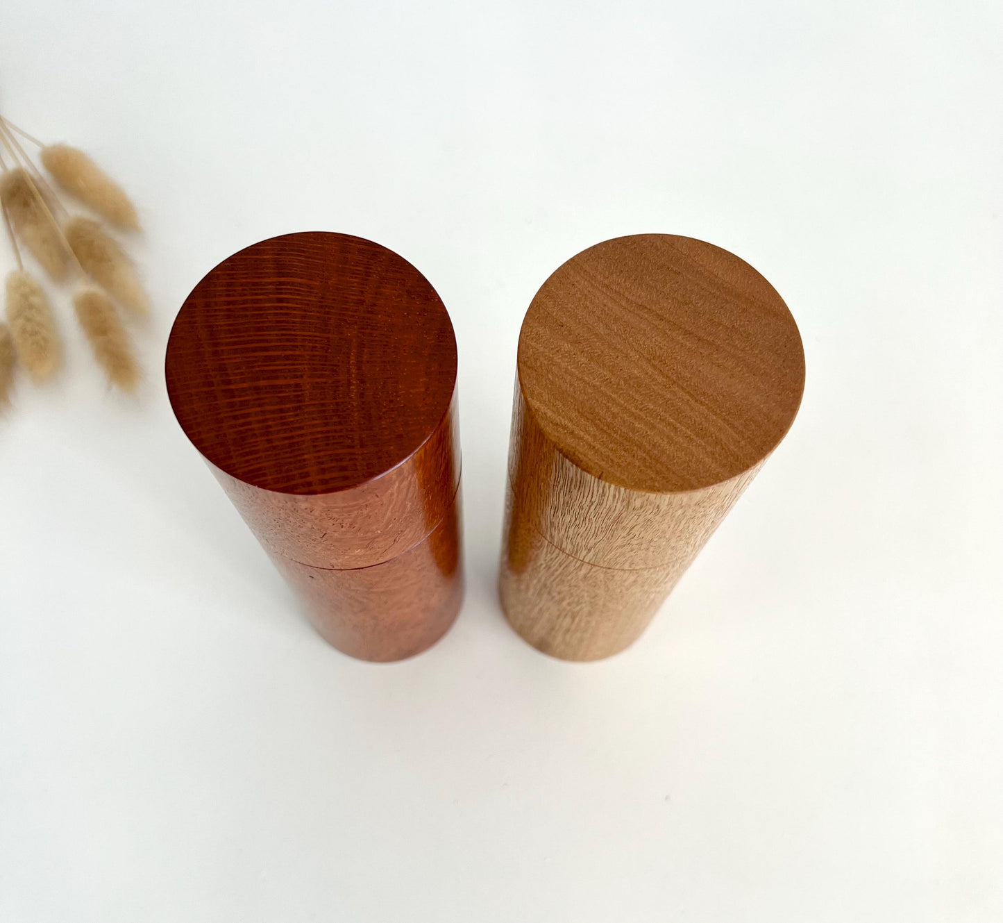 Birdseye view of wooden cylindrical shape salt and pepper grinders made from Australian Sheoak and Blackbutt timbers
