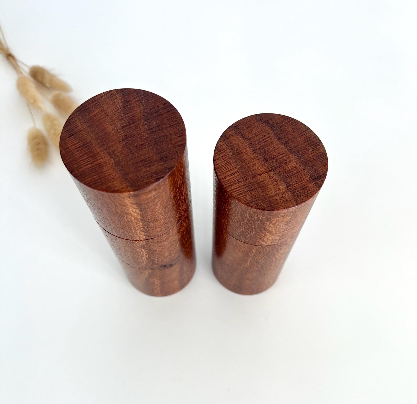 Birdseye view of wooden cylindrical shape salt and pepper grinders made from Australian Banksia timber