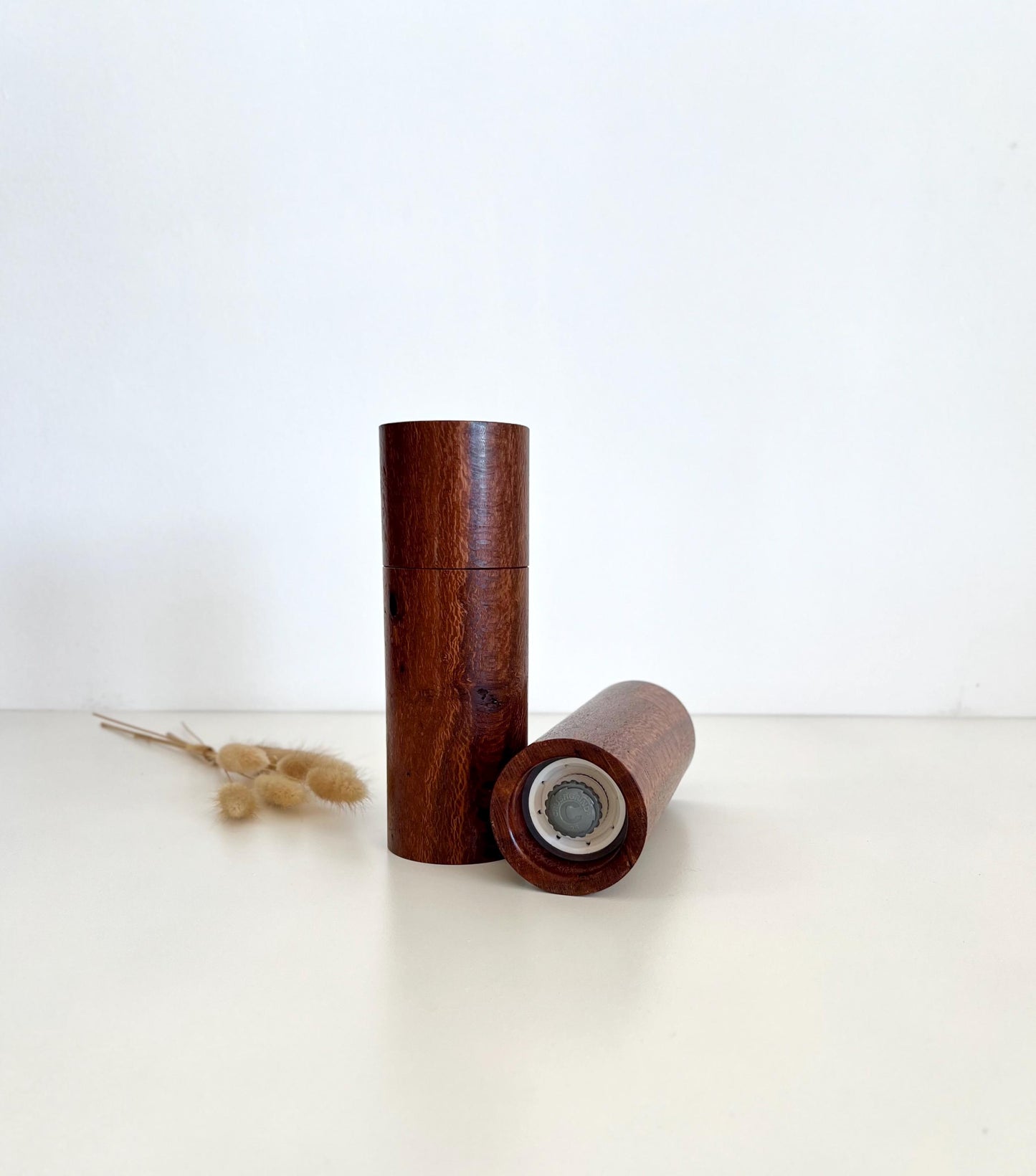 Bottom of salt and pepper grinder showing Crushgrind ceramic grinding mechanism and the adjustment knob