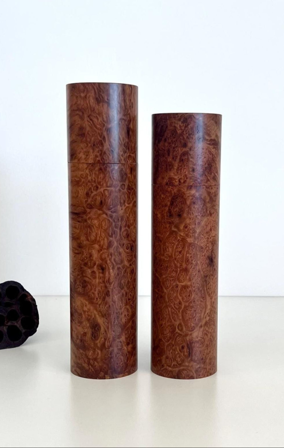 Wooden cylindrical shape salt and pepper grinders made from Blackbutt burl timber