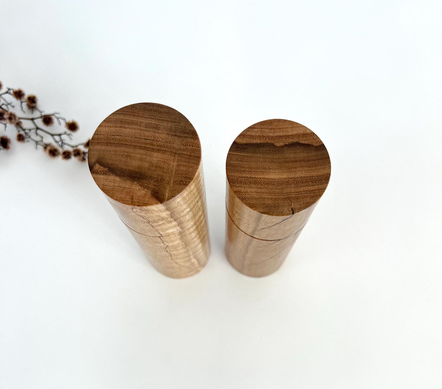 Birdseye view of wooden cylindrical shape salt and pepper grinders made from Australian Marri timber
