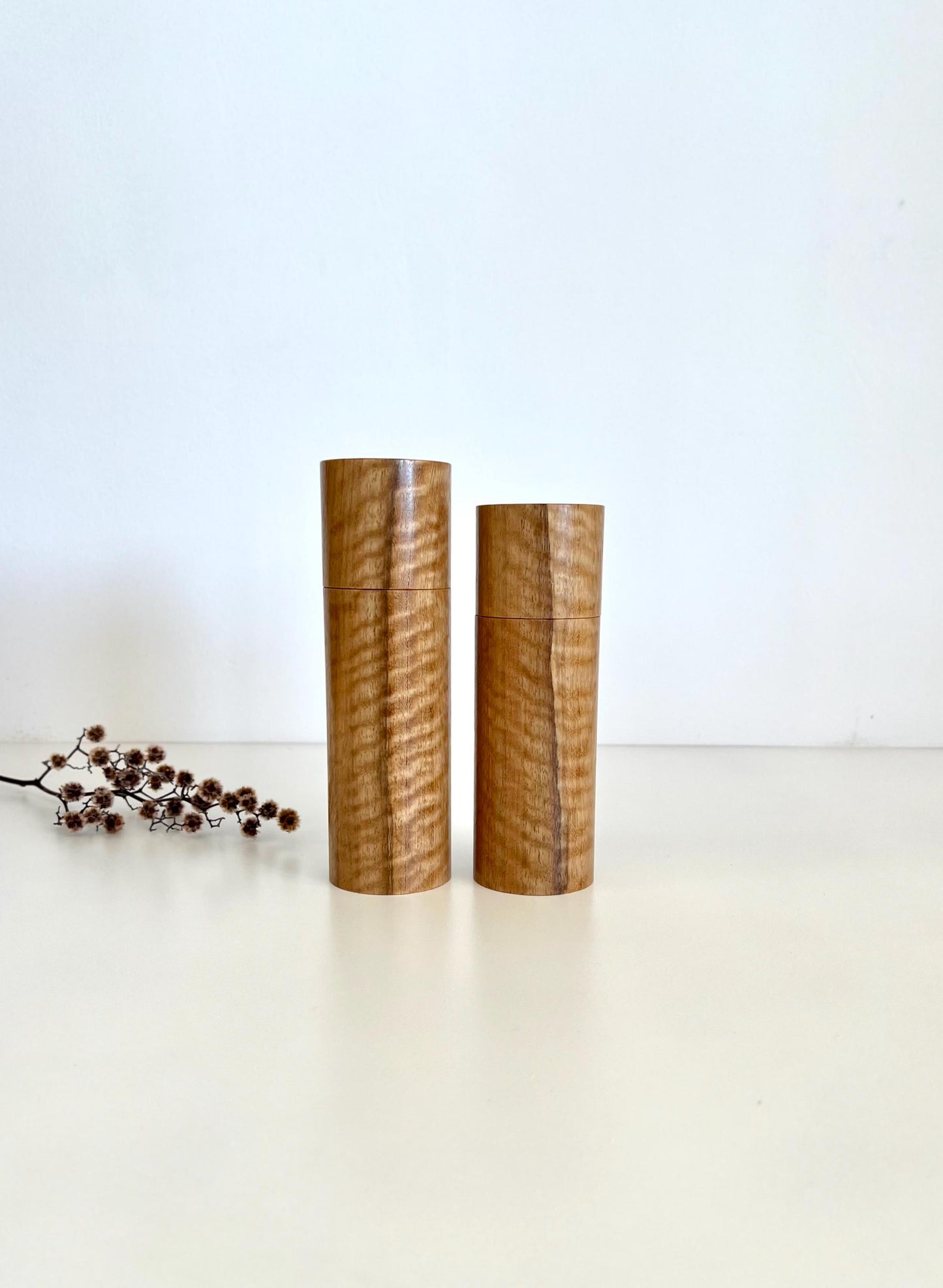Wooden cylindrical shape salt and pepper grinders made from Marri timber