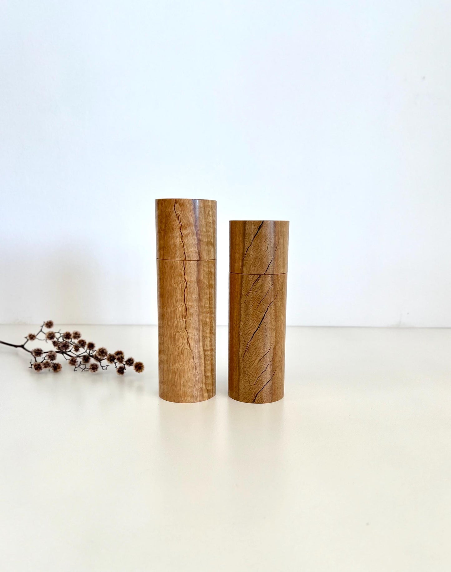 Wooden cylindrical shape salt and pepper grinders made from Marri timber