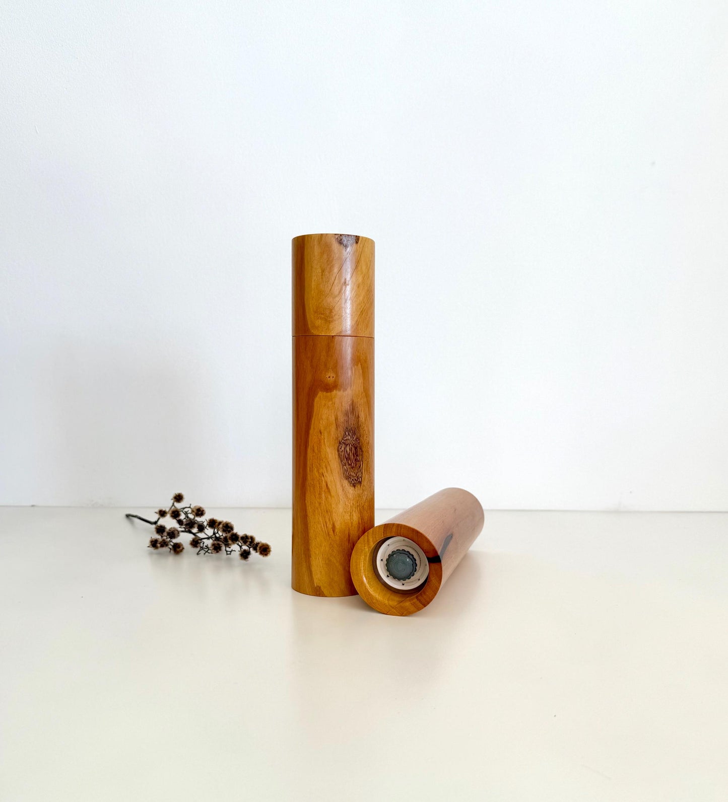 Bottom of salt and pepper grinder showing Crushgrind ceramic grinding mechanism and the adjustment knob