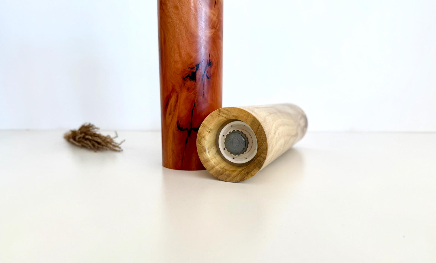 Bottom of salt and pepper grinder showing Crushgrind ceramic grinding mechanism and the adjustment knob