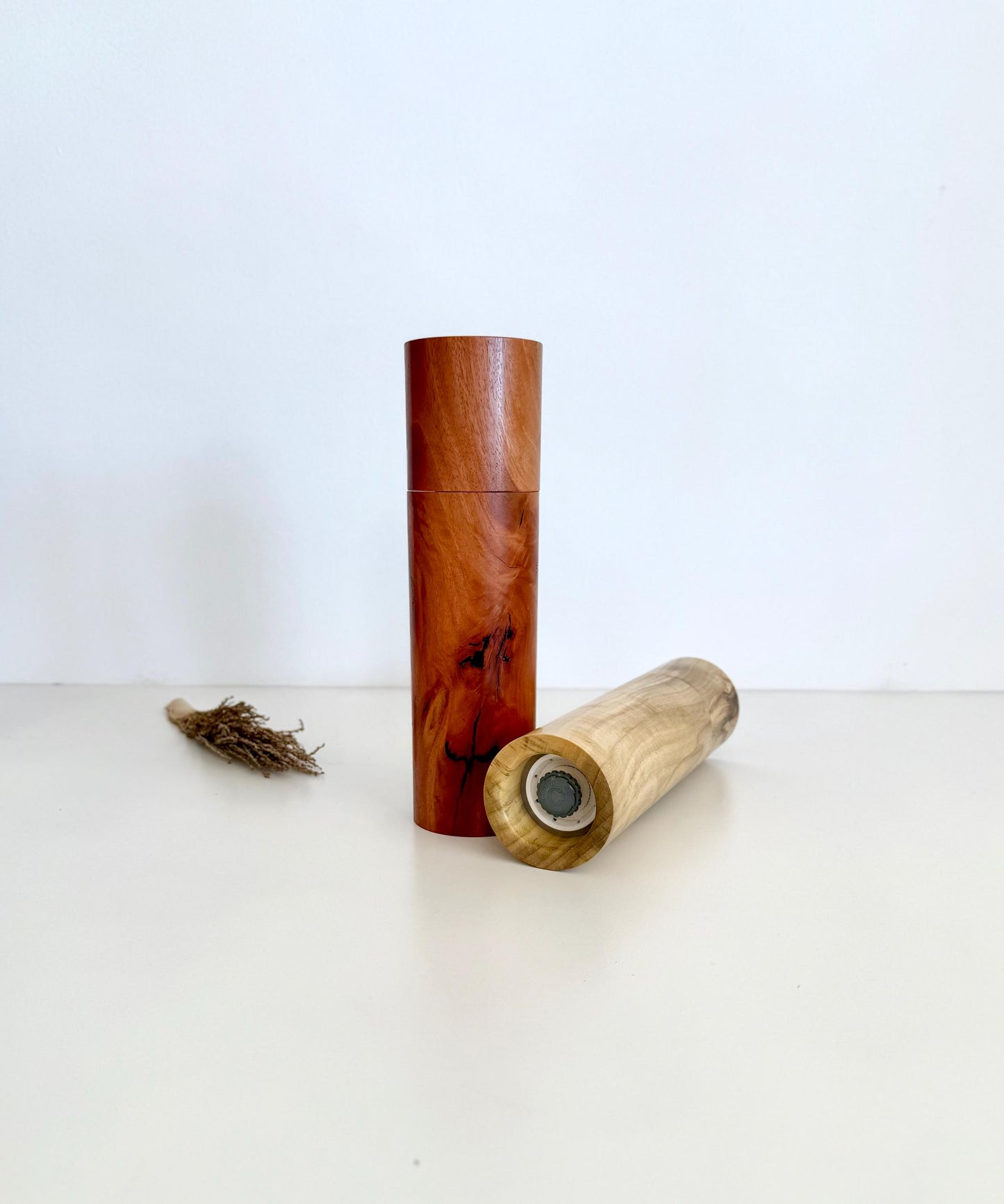 Bottom of salt and pepper grinder showing Crushgrind ceramic grinding mechanism and the adjustment knob