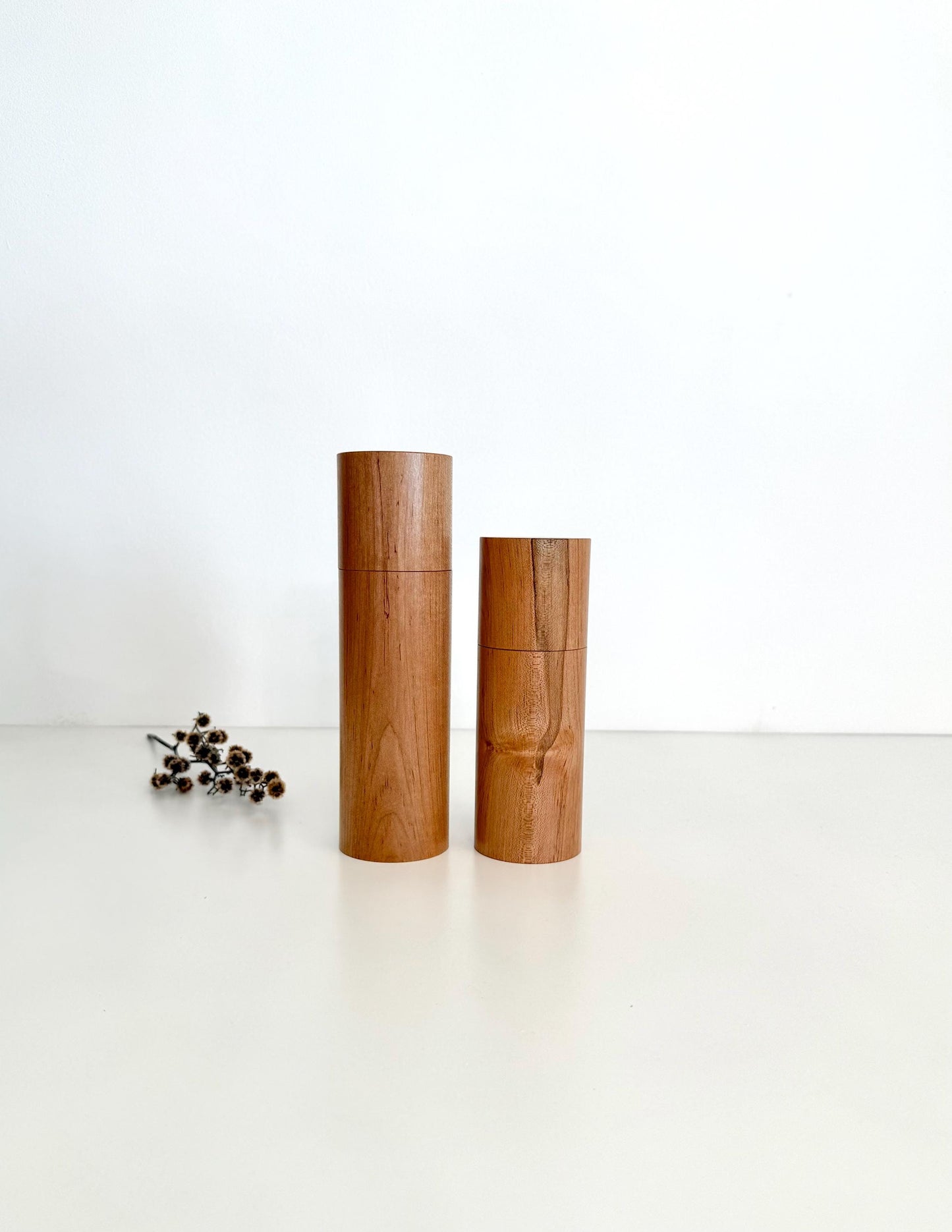 Wooden cylindrical shape salt and pepper grinders made from Maple timber