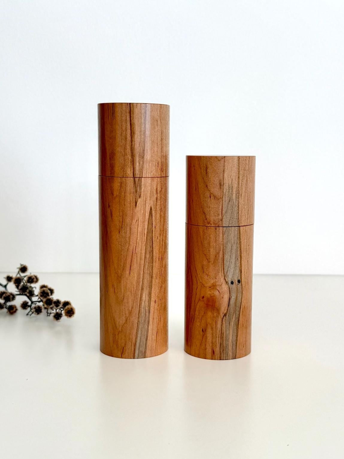 Wooden cylindrical shape salt and pepper grinders made from Maple timber