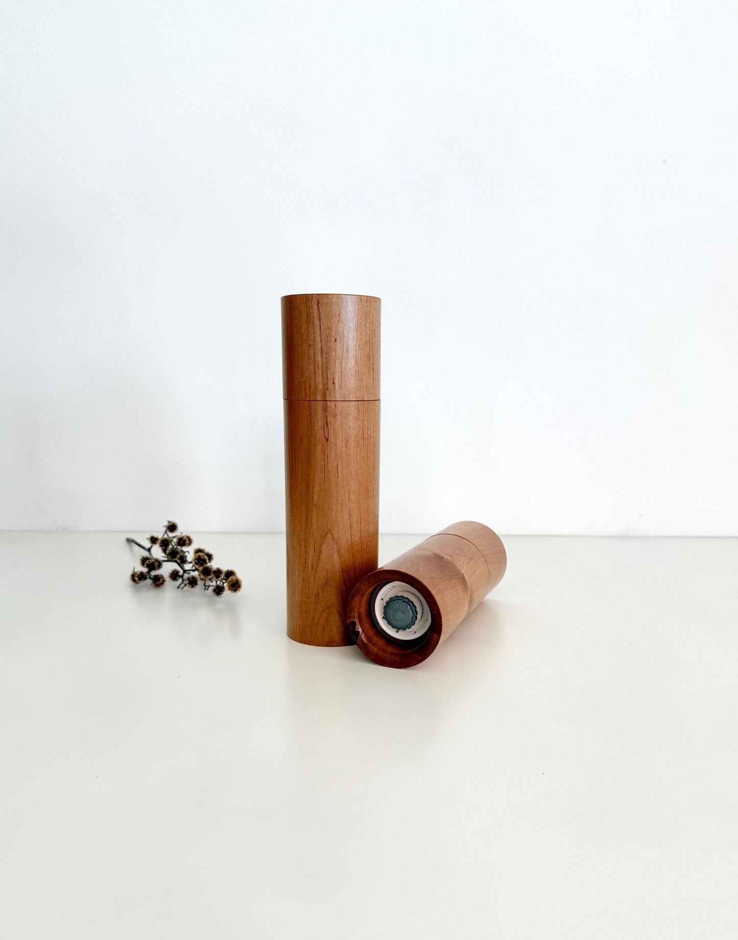 Bottom of salt and pepper grinder showing Crushgrind ceramic grinding mechanism and the adjustment knob