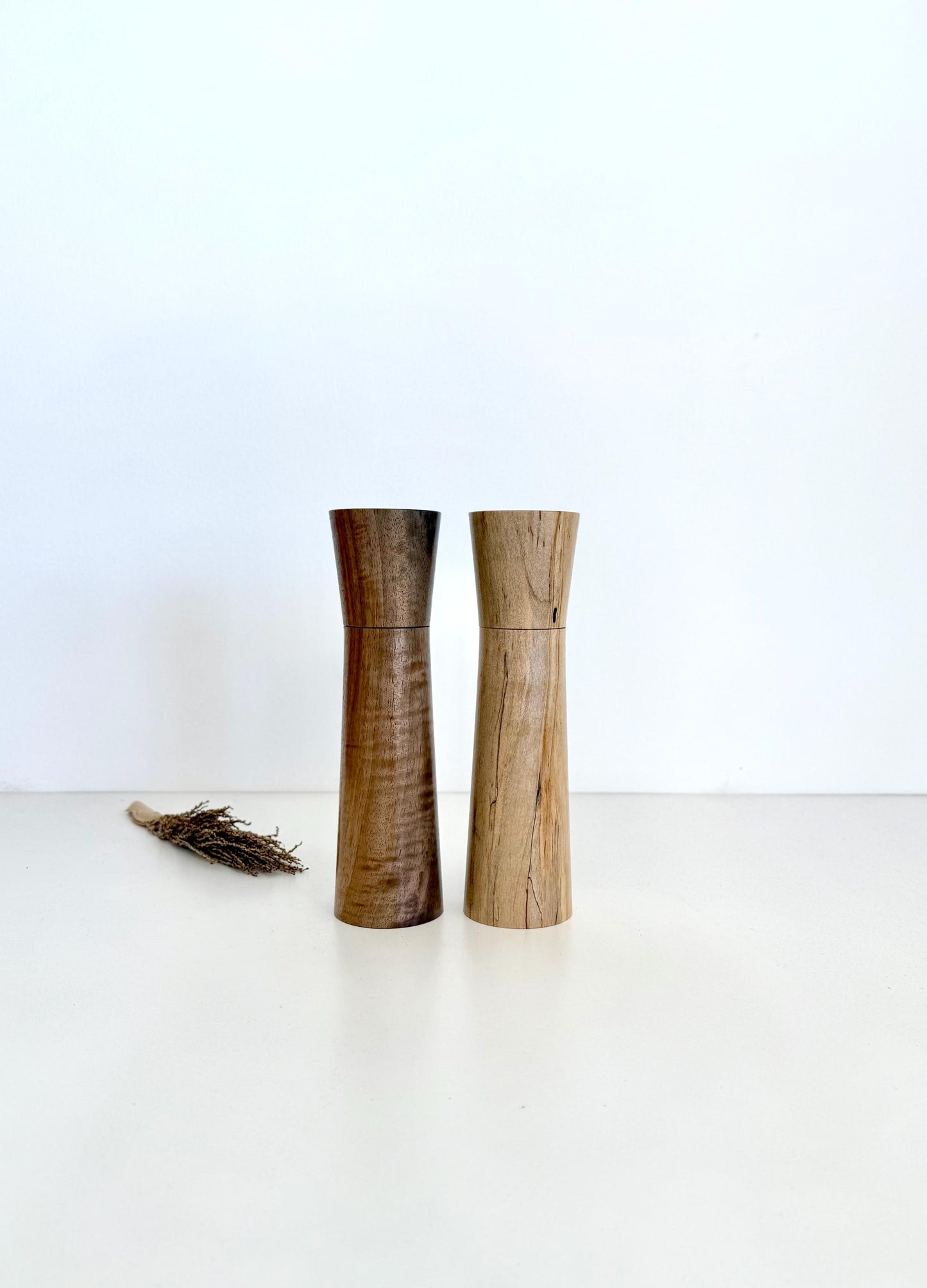 Wooden cylindrical shape salt and pepper grinders made from Walnut and Maple timbers