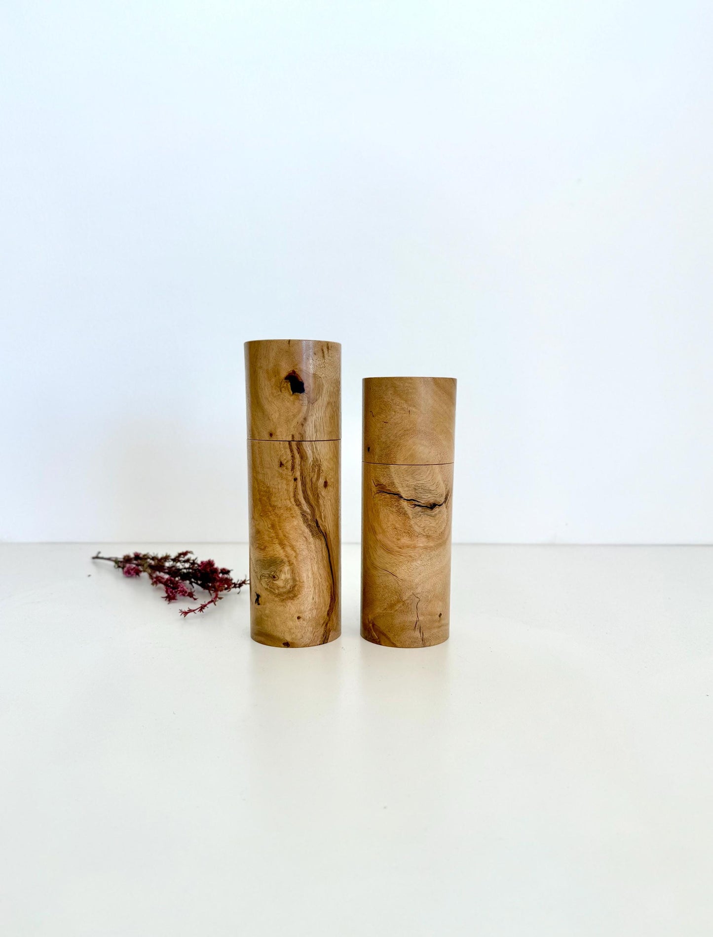 Wooden cylindrical shape salt and pepper grinders made from Lemon scented gum