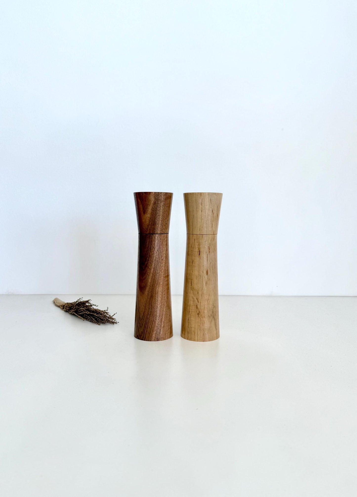 Wooden cylindrical shape salt and pepper grinders made from Walnut and Maple timbers