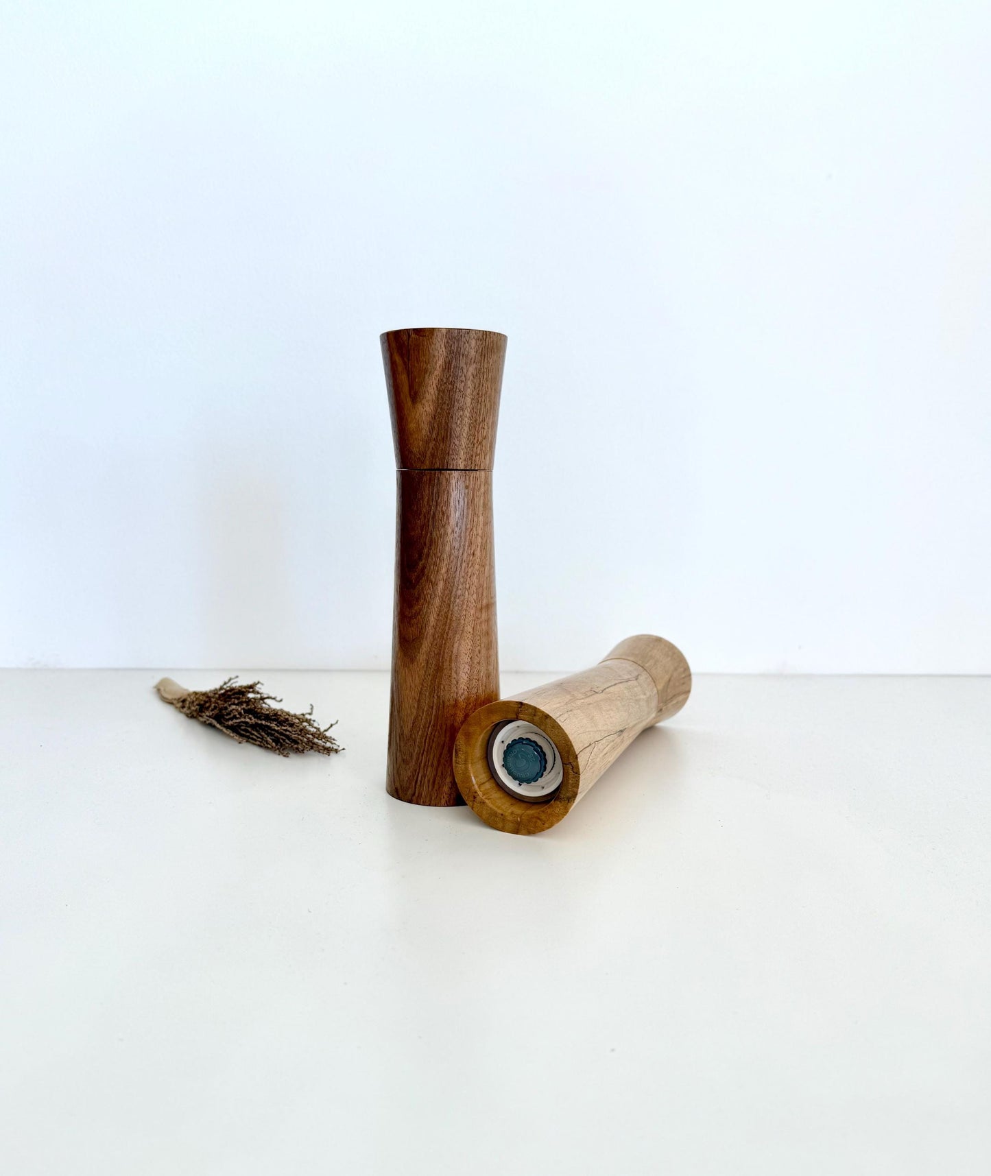 Bottom of salt and pepper grinder showing Crushgrind ceramic grinding mechanism and the adjustment knob