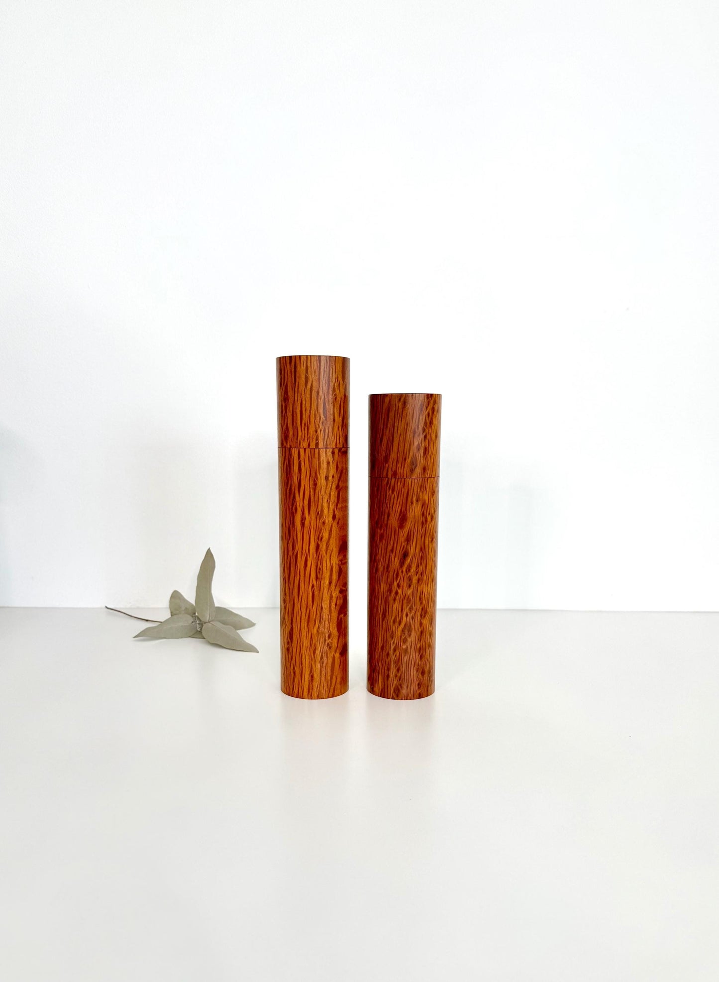 Wooden cylindrical shape salt and pepper grinders made from Sheoak timber