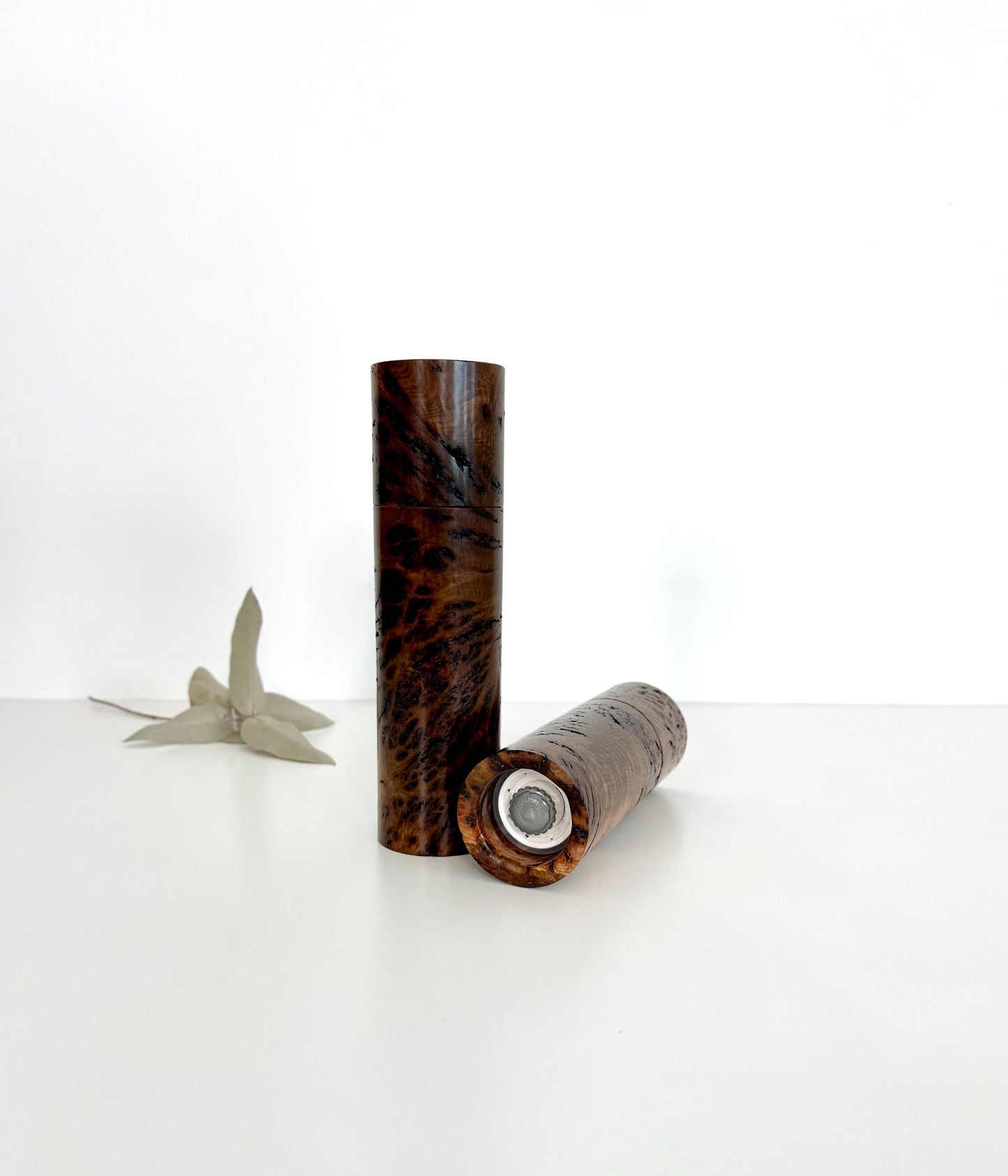 Bottom of salt and pepper grinder showing Crushgrind ceramic grinding mechanism and the adjustment knob