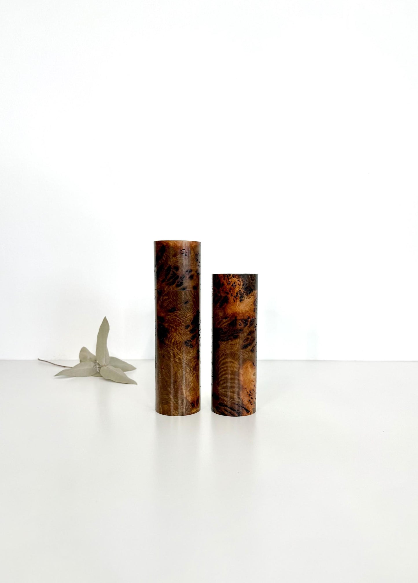 Wooden cylindrical shape salt and pepper grinders made from Gimlet burl timber