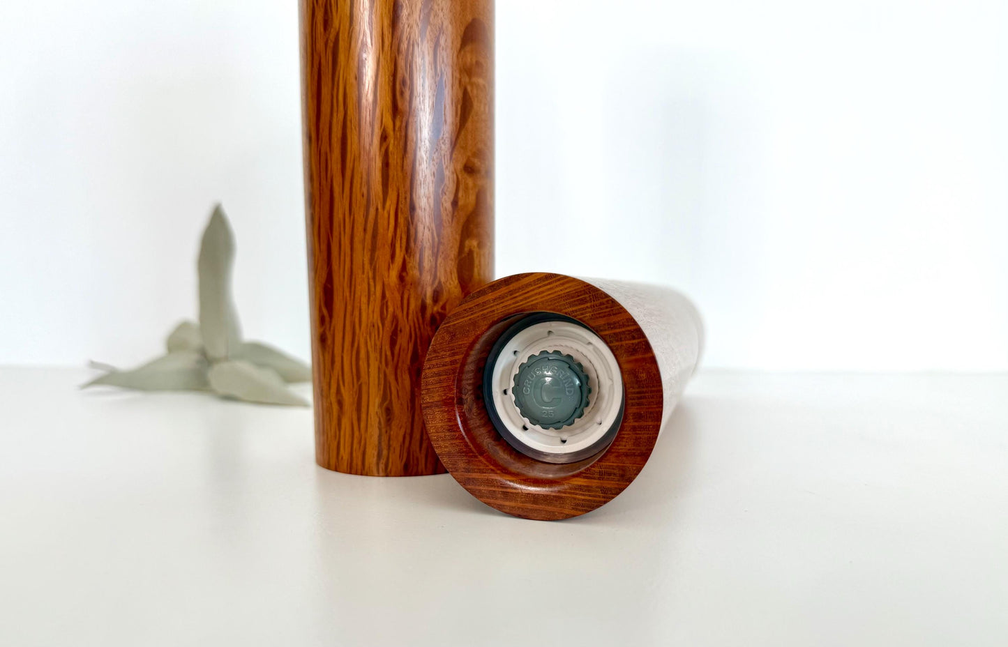 Bottom of salt and pepper grinder showing Crushgrind ceramic grinding mechanism and the adjustment knob