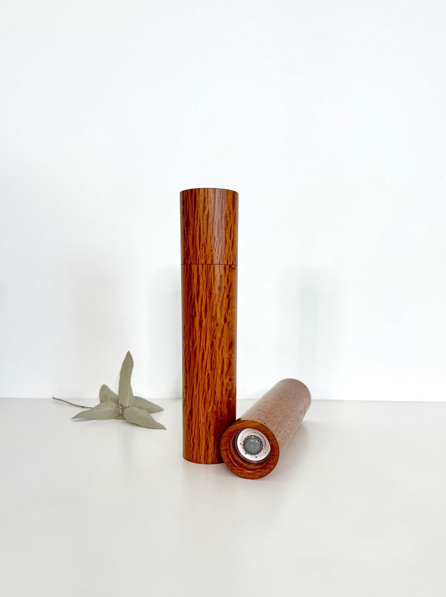 Bottom of salt and pepper grinder showing Crushgrind ceramic grinding mechanism and the adjustment knob