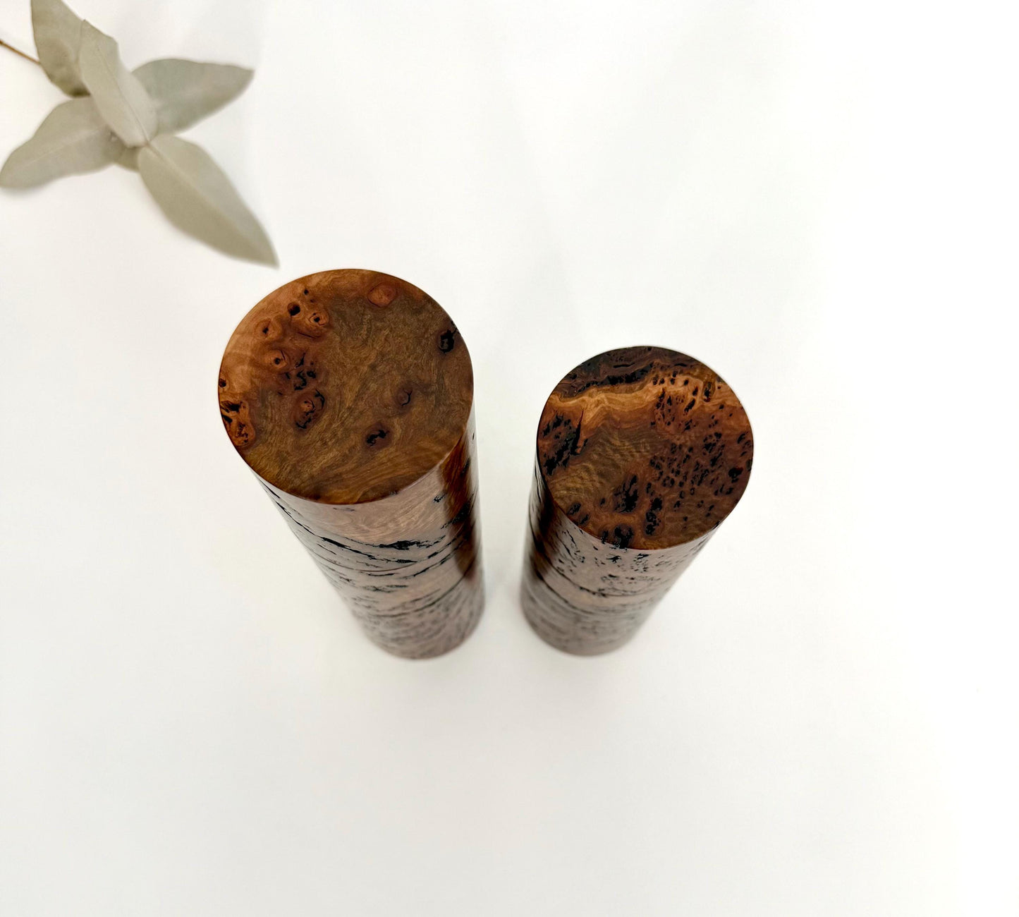 Birdseye view of wooden cylindrical shape salt and pepper grinders made from Australian Gimlet burl timber