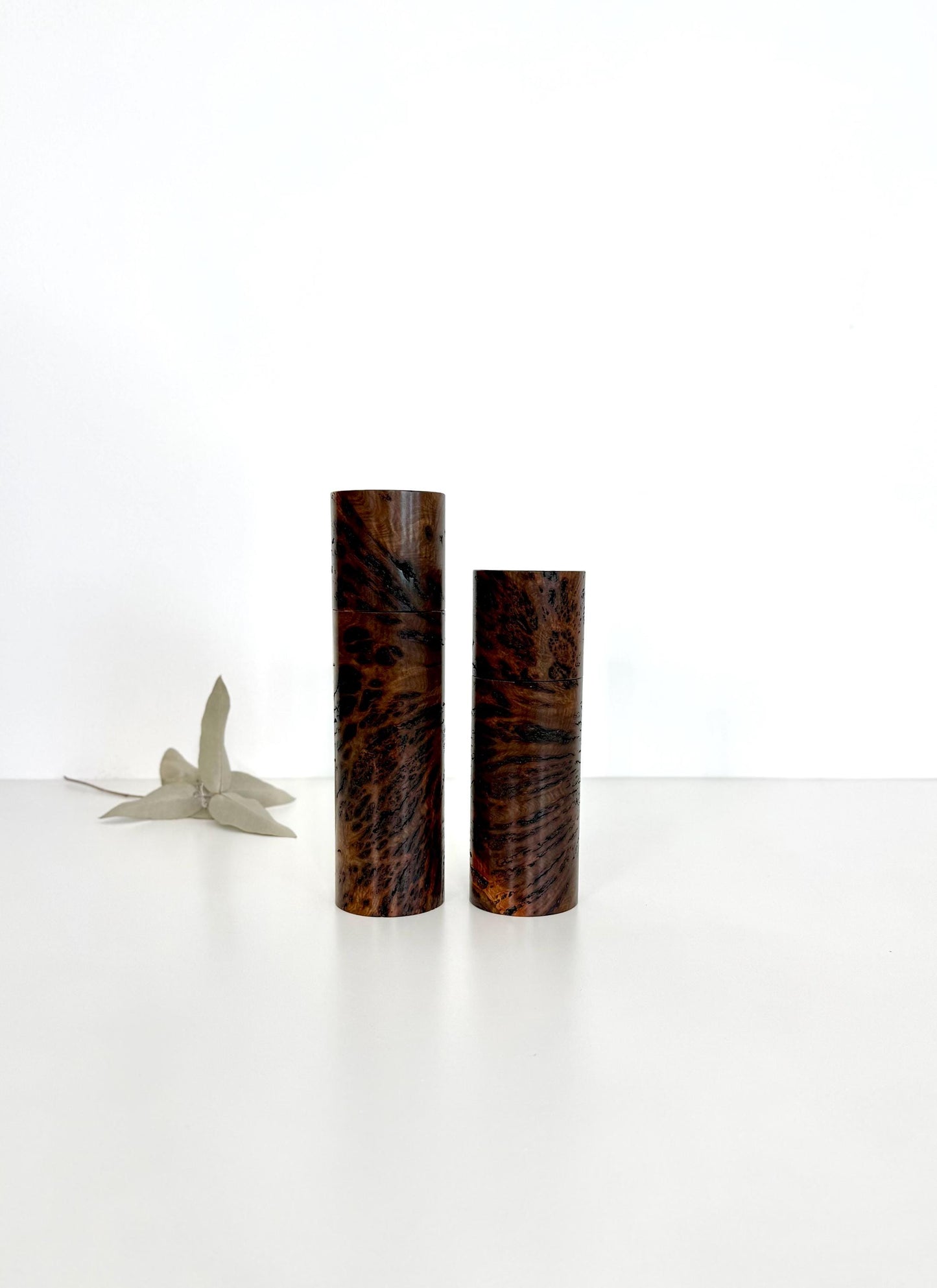 Wooden cylindrical shape salt and pepper grinders made from Gimlet burl timber