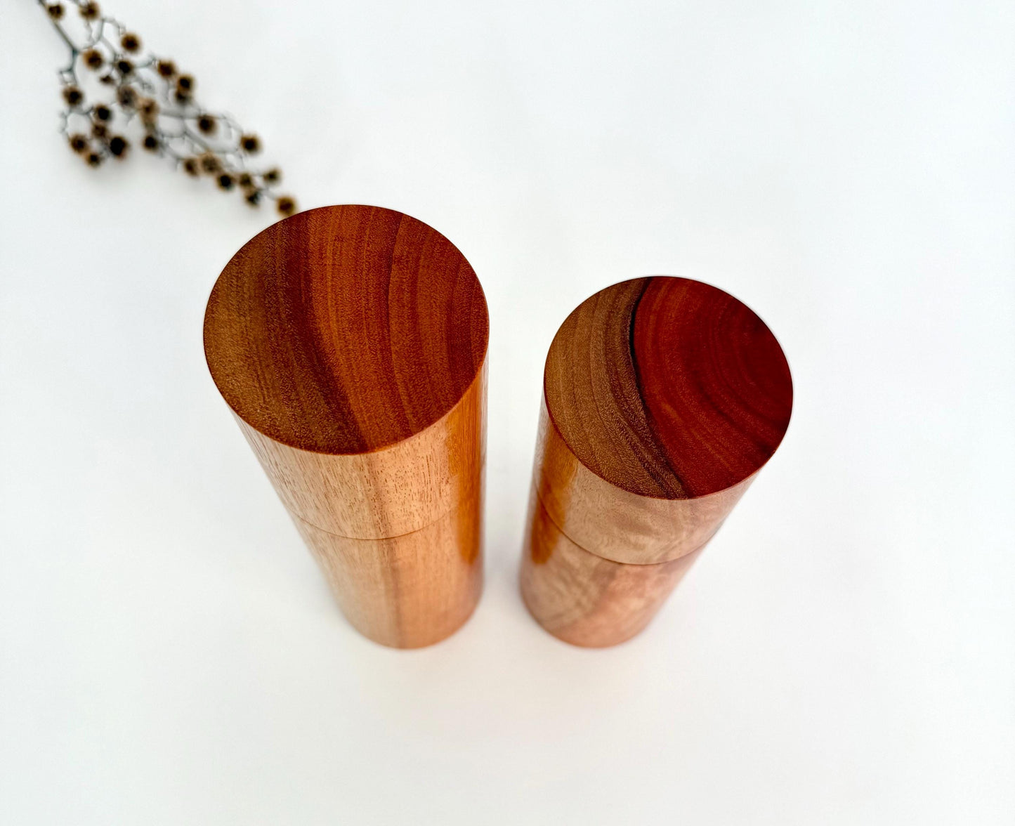 Birdseye view of wooden cylindrical shape salt and pepper grinders made from Australian River Red Gum timber