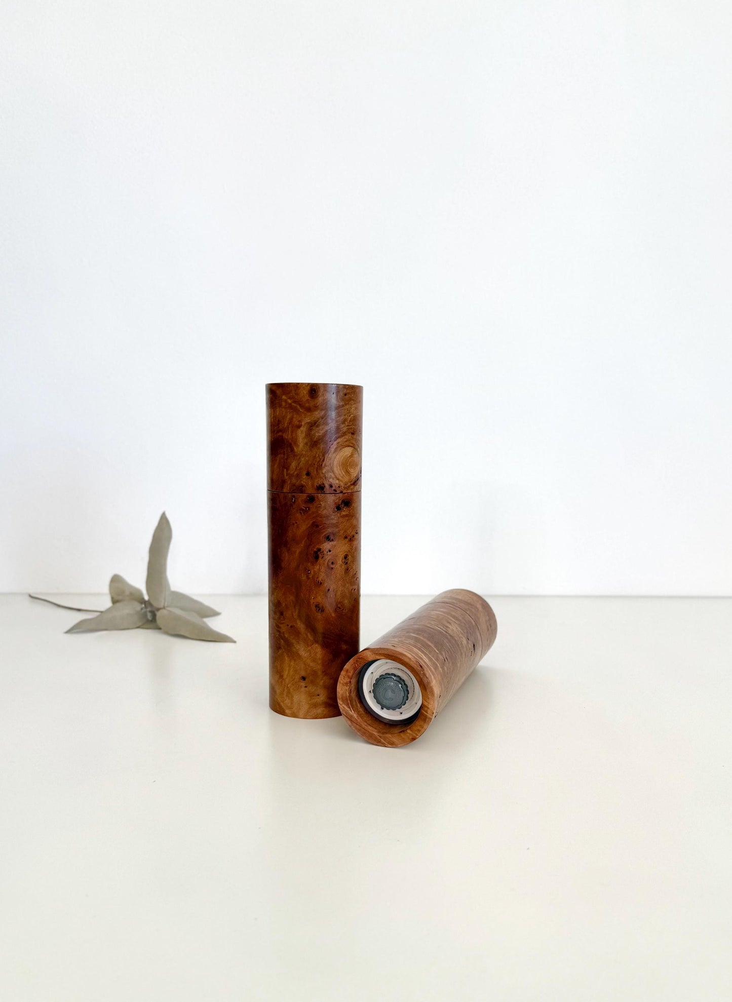 Bottom of salt and pepper grinder showing Crushgrind ceramic grinding mechanism and the adjustment knob