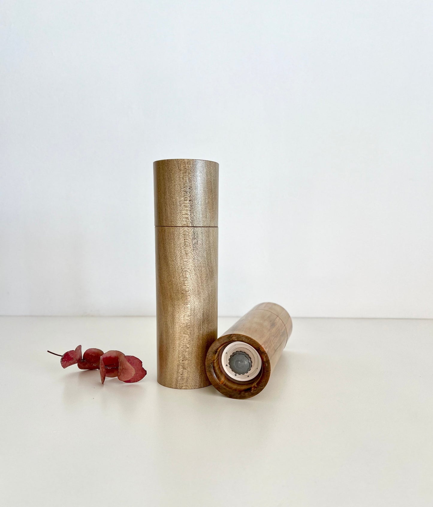 Bottom of salt and pepper grinder showing Crushgrind ceramic grinding mechanism and the adjustment knob
