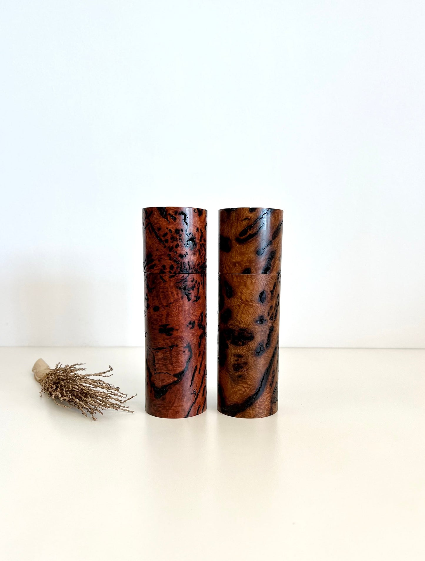 Wooden cylindrical shape salt and pepper grinders made from Australian Bimble box burl and salmon gum burl timbers