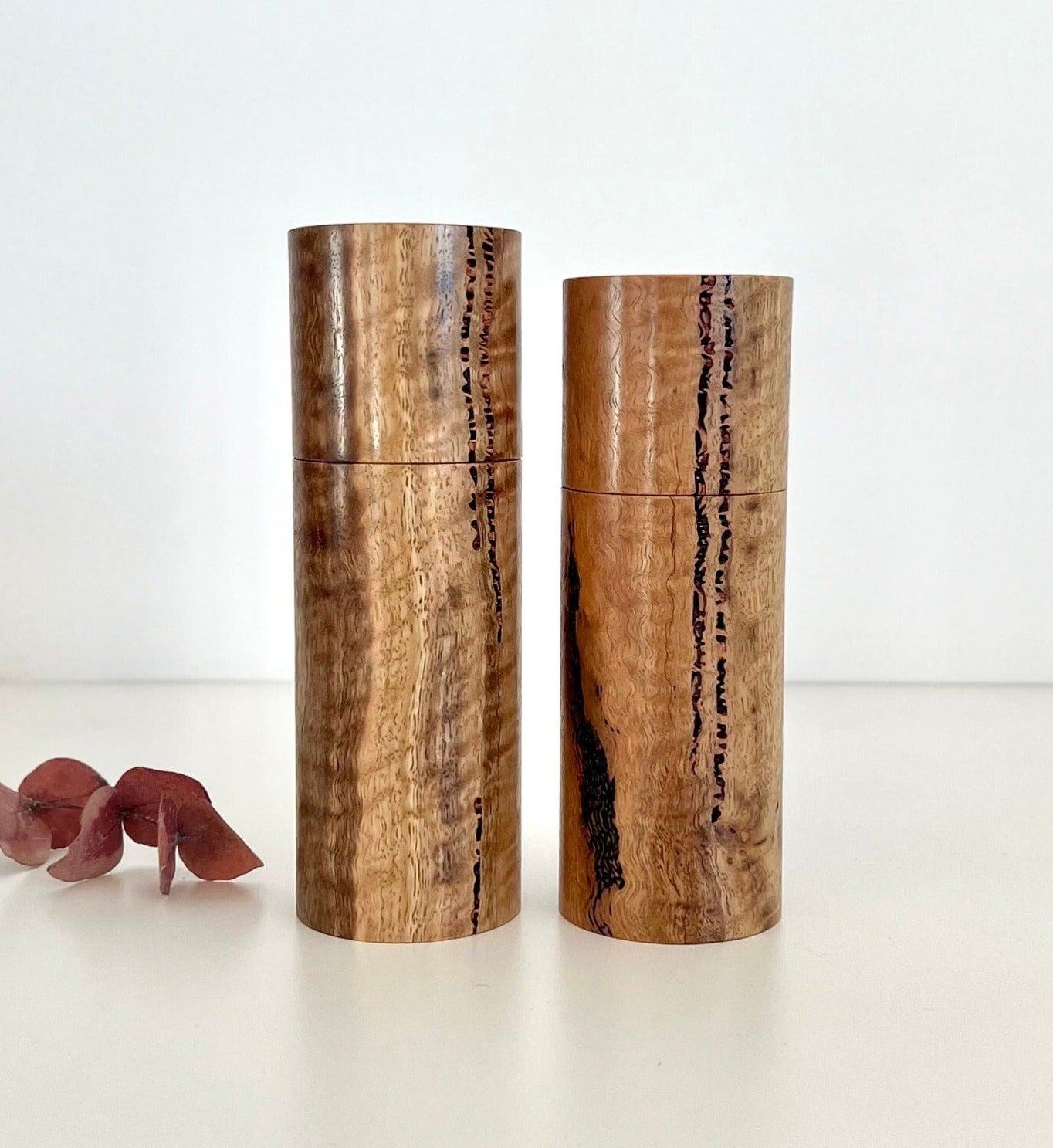 Wooden cylindrical shape salt and pepper grinders made from Australian Marri timber