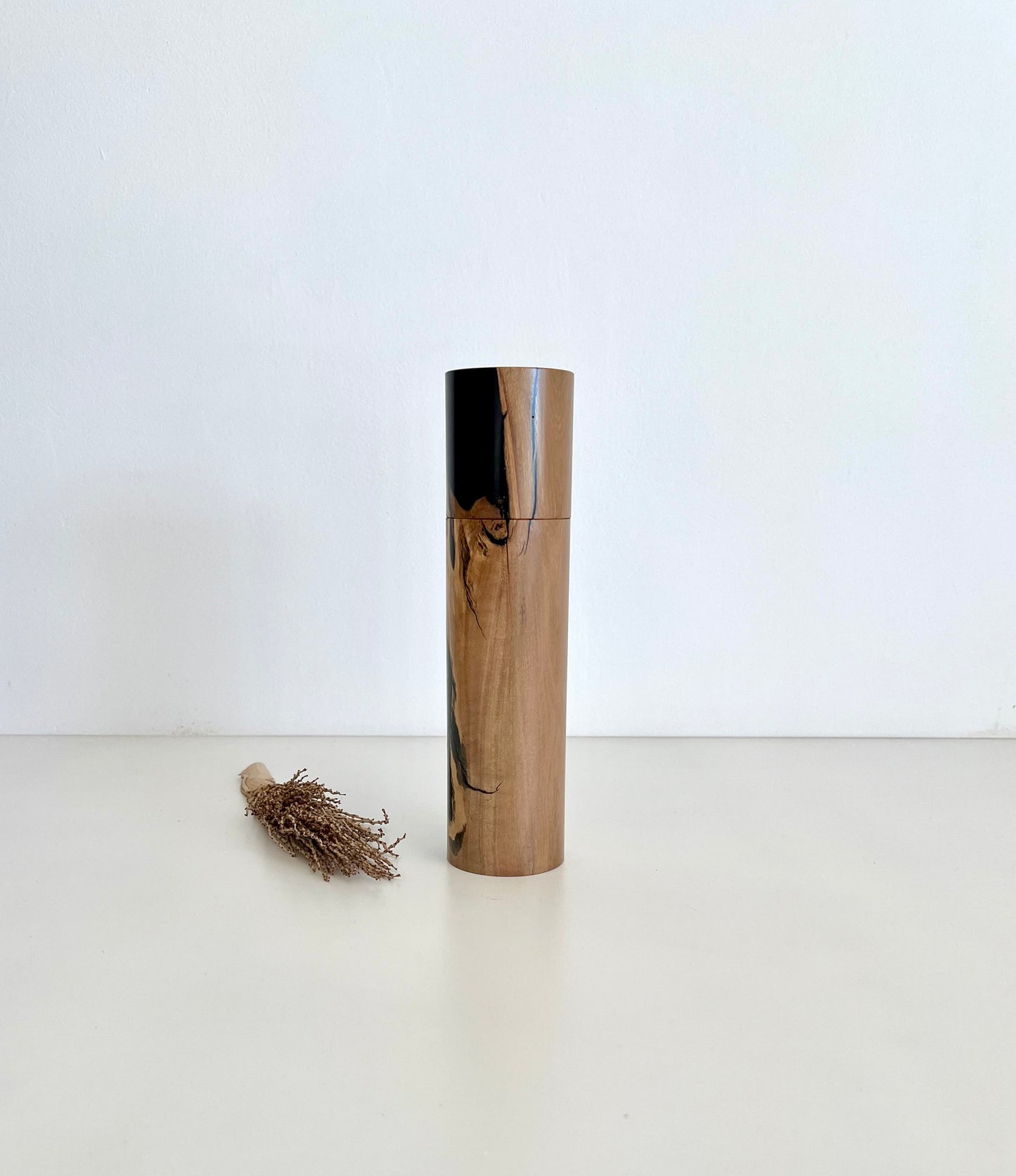 Wooden cylindrical shape salt or pepper grinder made from Australian Olive timber