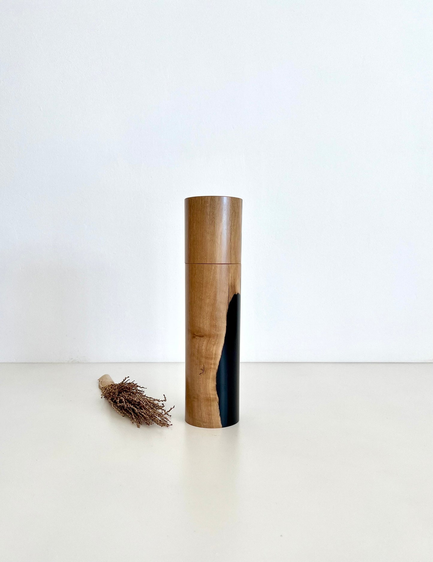 Wooden cylindrical shape salt or pepper grinder made from Australian Olive timber