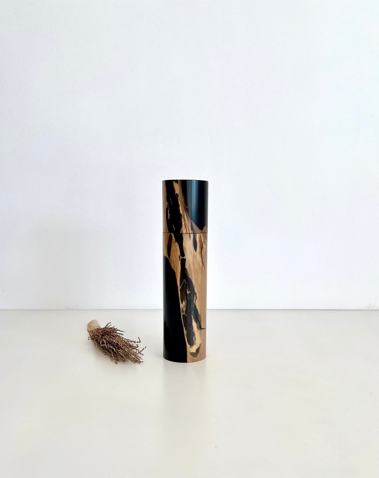 Wooden cylindrical shape salt or pepper grinder made from Australian Olive timber