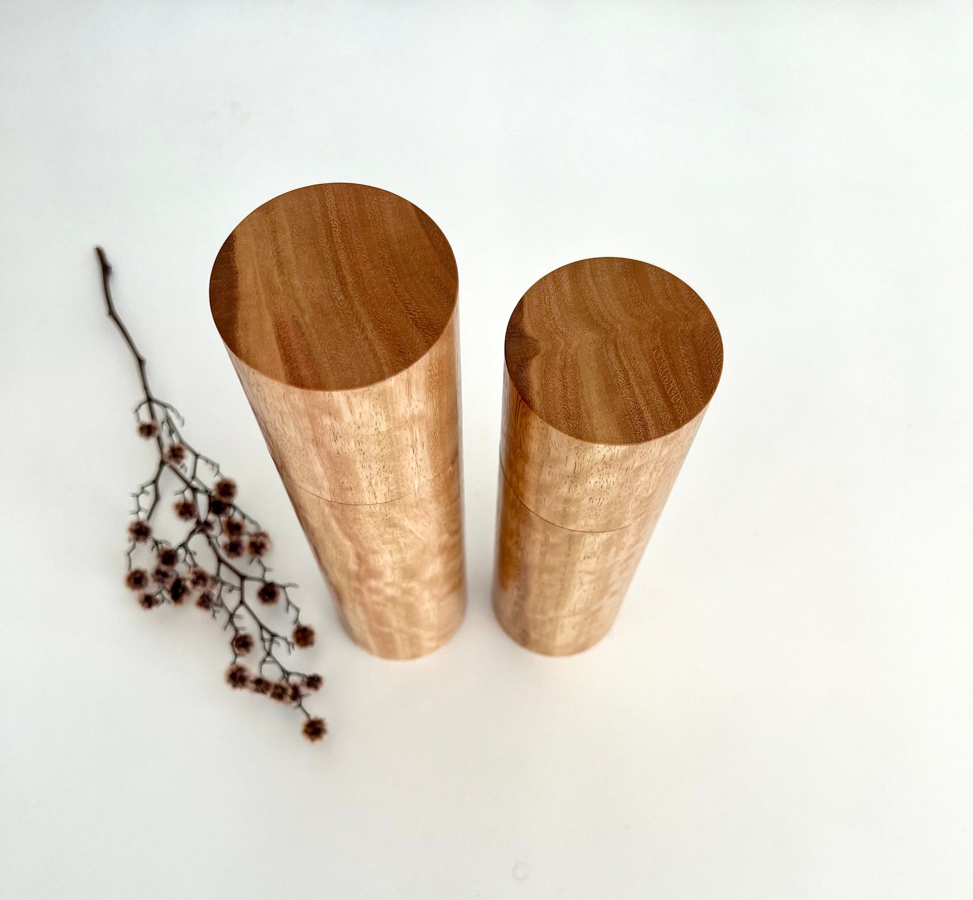 Birdseye view of wooden cylindrical shape salt and pepper grinders made from Australian Tasmanian Blue gum timber