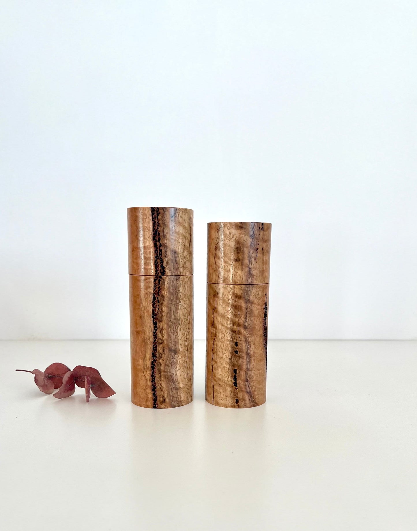 Wooden cylindrical shape salt and pepper grinders made from Australian Marri timber