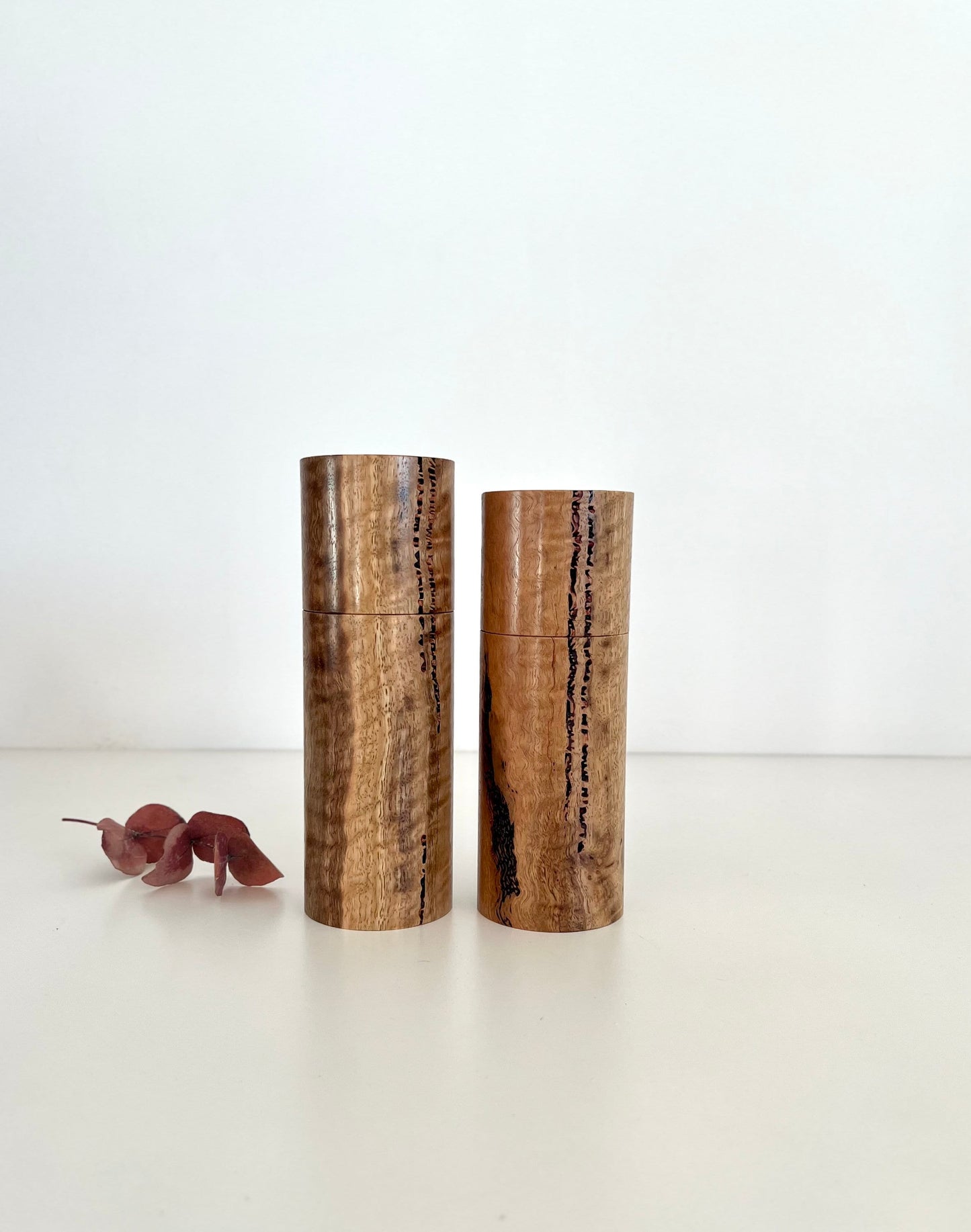 Wooden cylindrical shape salt and pepper grinders made from Australian Marri timber