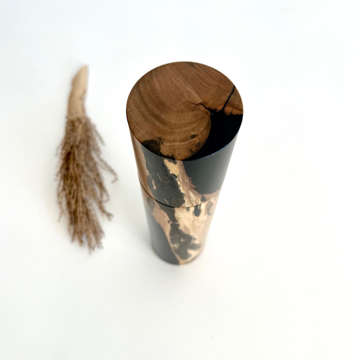 Birdseye view of wooden cylindrical shape salt or pepper grinder made from Australian driftwood timber.