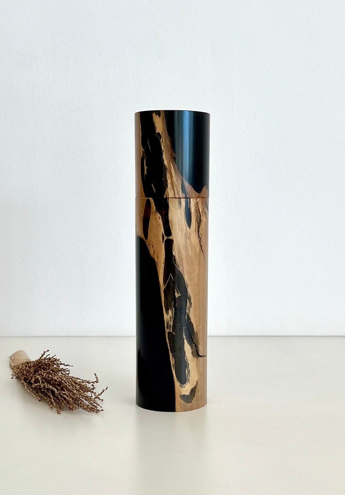 Wooden cylindrical shape salt or pepper grinder made from Australian Olive timber