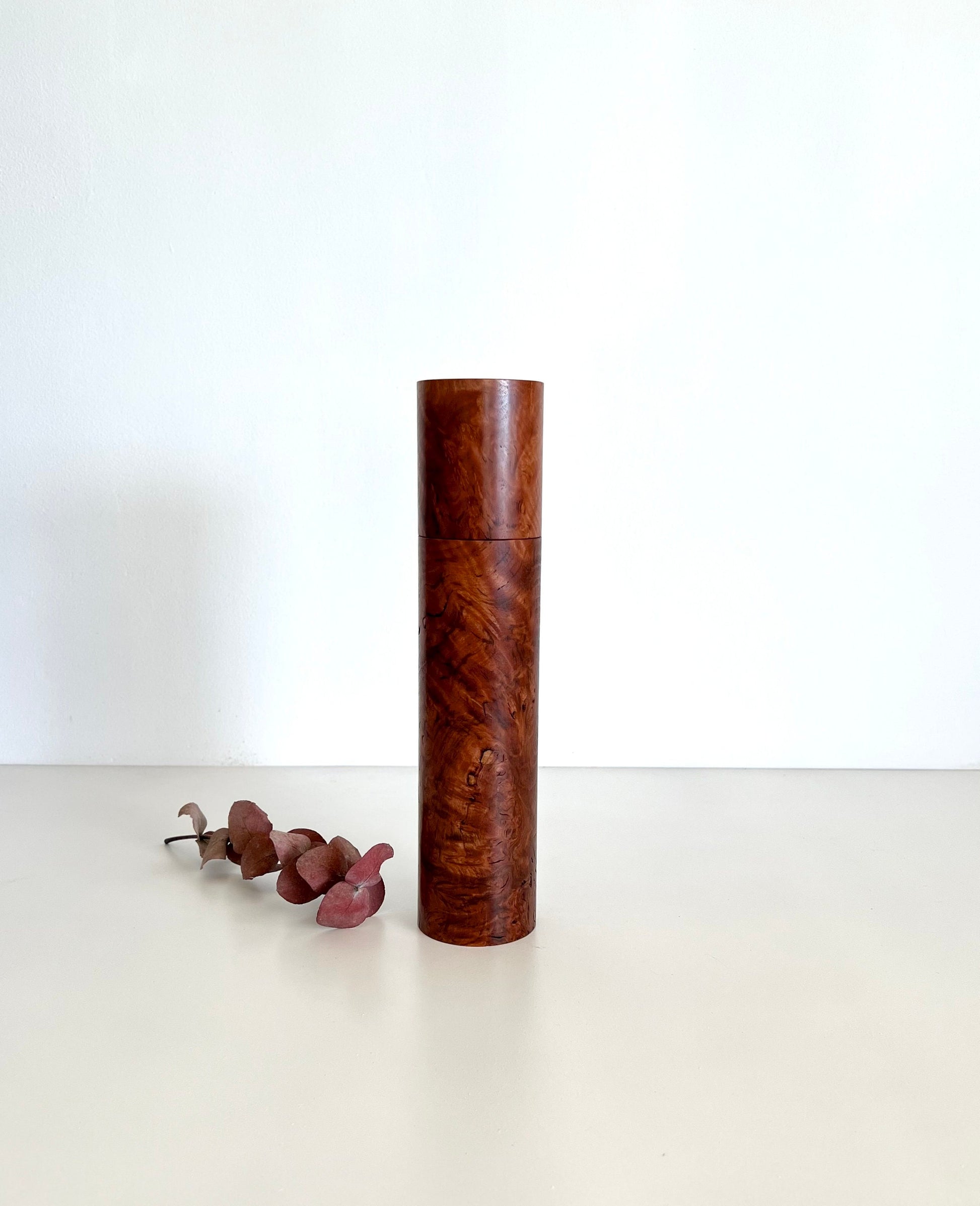 Wooden cylindrical shape salt and pepper grinder made from Australian Red Tingle burl timber