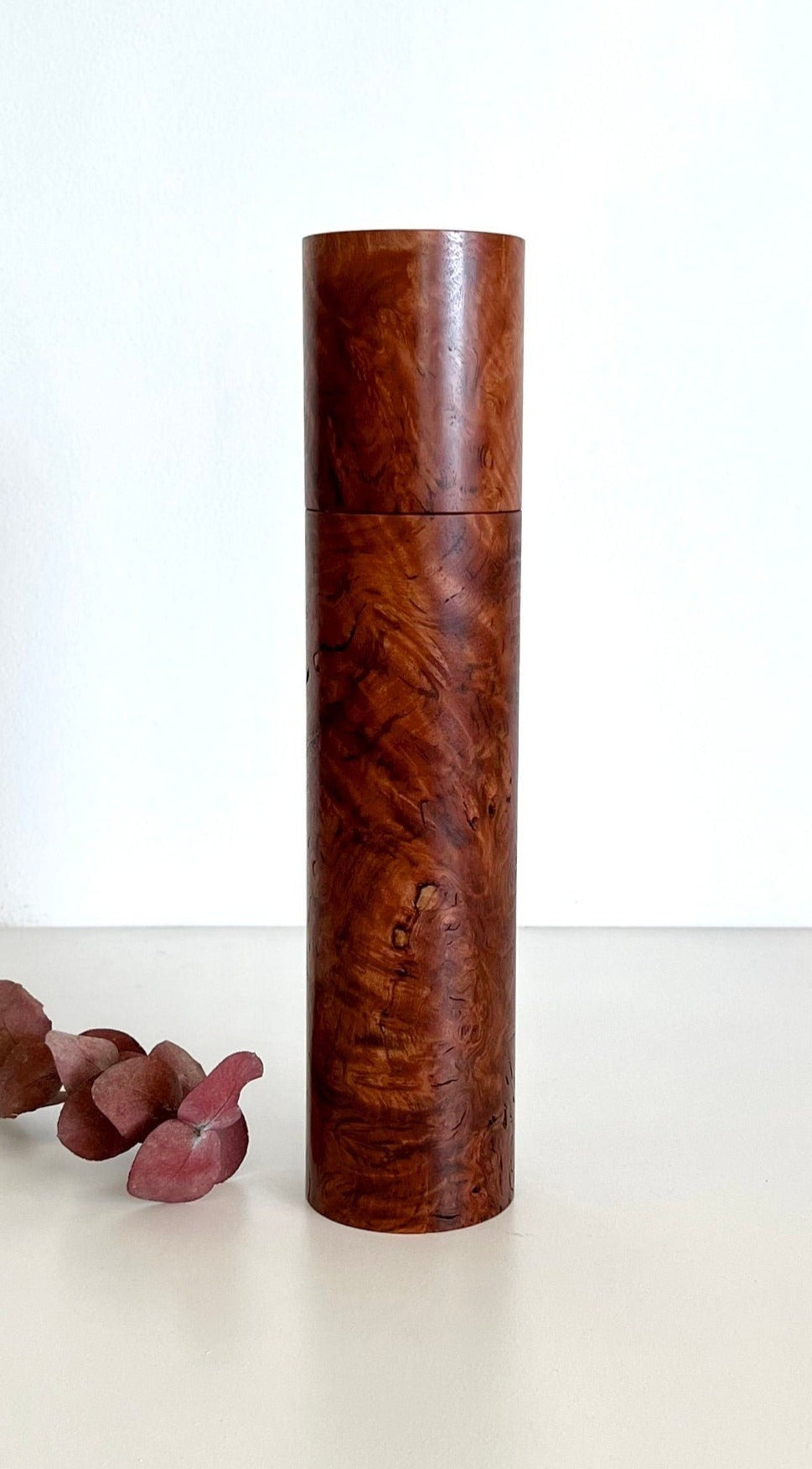 Wooden cylindrical shape salt and pepper grinder made from Australian Red Tingle burl timber