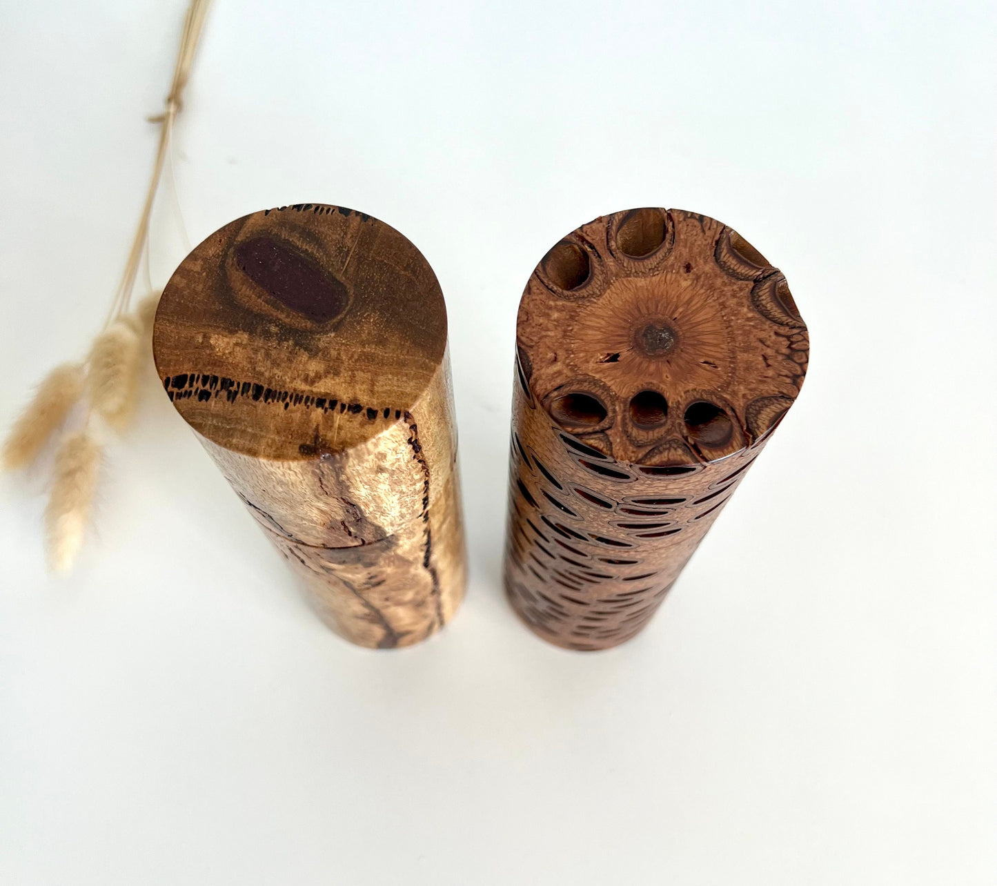 Birdseye view of wooden cylindrical shape salt and pepper grinder